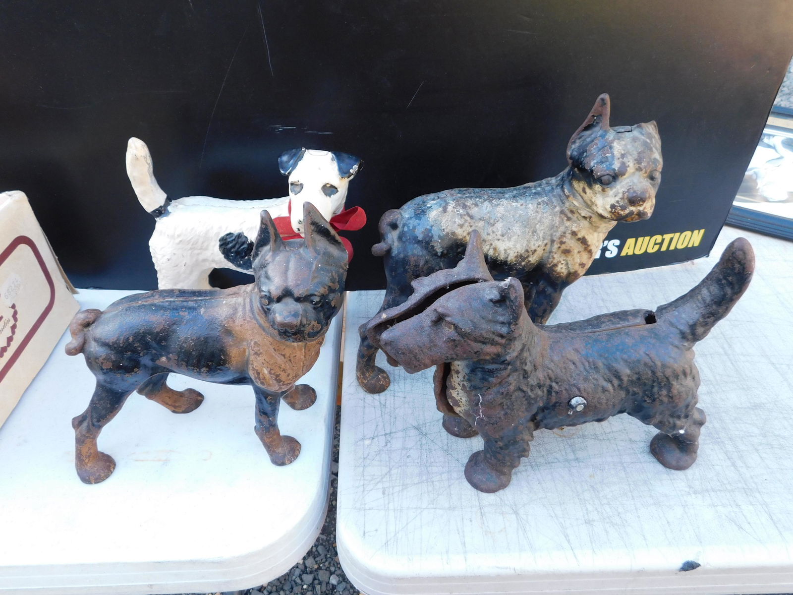 Lot of 4 Cast Iron Dog Doorstops: Lot of 4 Cast Iron Dog Doorstops. You are bidding at a live sale. Please read the terms and conditions. This sale will be broadcast live on sale day with full descriptions of each lot being sold, as w