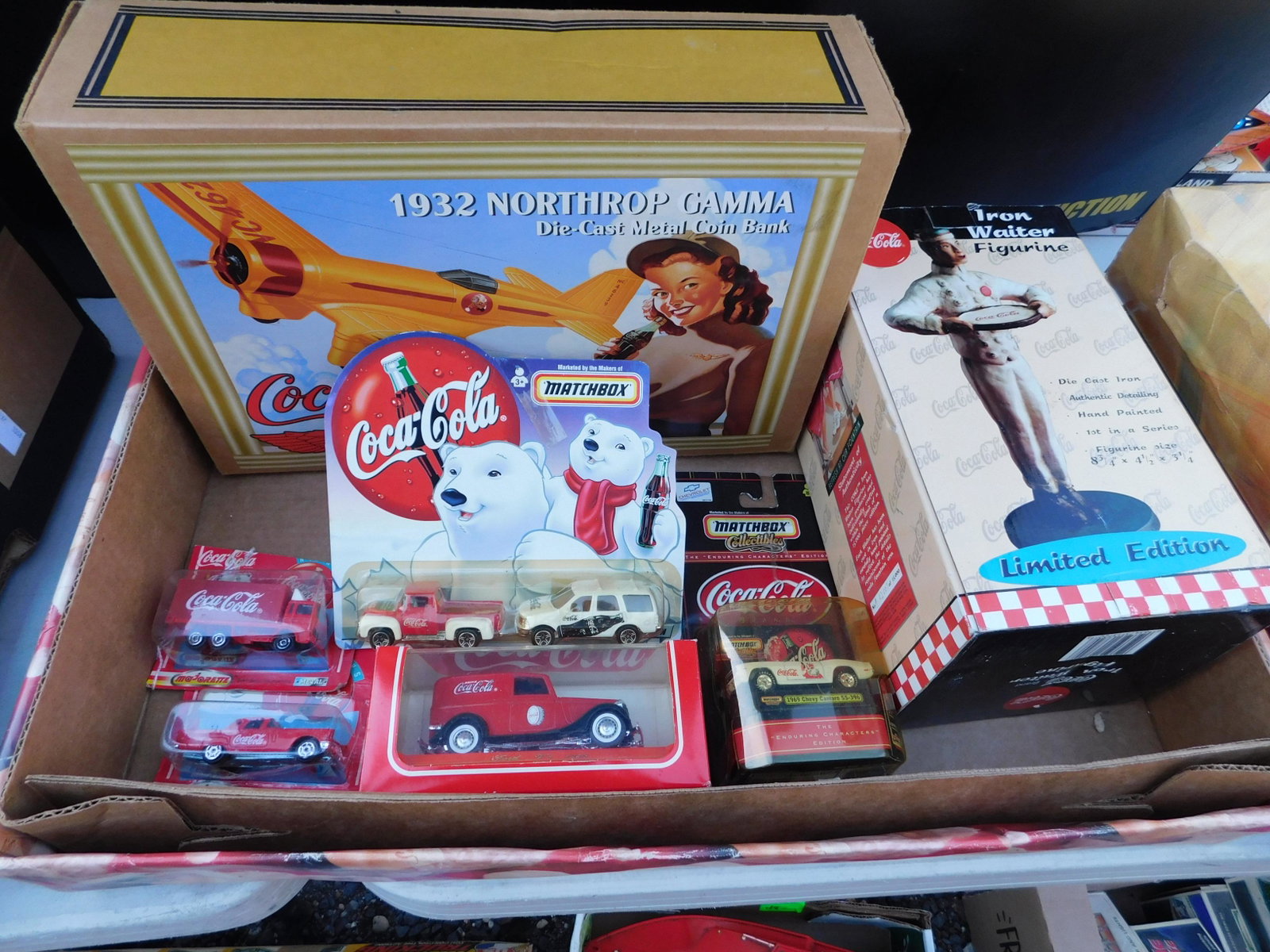 Box Lot of Coca Cola Items: Box Lot of Coca-Cola Items. You are bidding at a live sale. Please read the terms and conditions. This sale will be broadcast live on sale day with full descriptions of each lot being sold, as well as