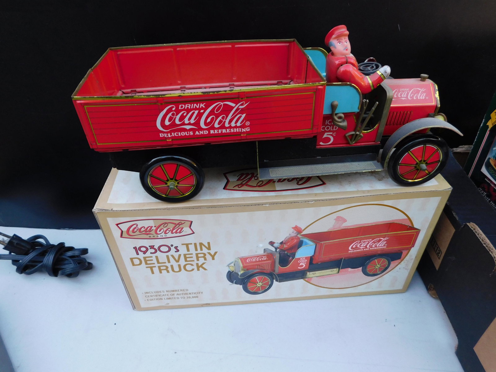 Coca Cola 1930's Tin Delivery Truck with Box: Coca Cola 1930's Tin Delivery Truck with Box. You are bidding at a live sale. Please read the terms and conditions. This sale will be broadcast live on sale day with full descriptions of each lot bein