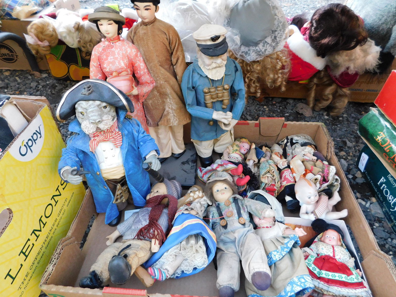 Box Lot of Dolls: Box Lot of Dolls from Around the World. You are bidding at a live sale. Please read the terms and conditions. This sale will be broadcast live on sale day with full descriptions of each lot being sold