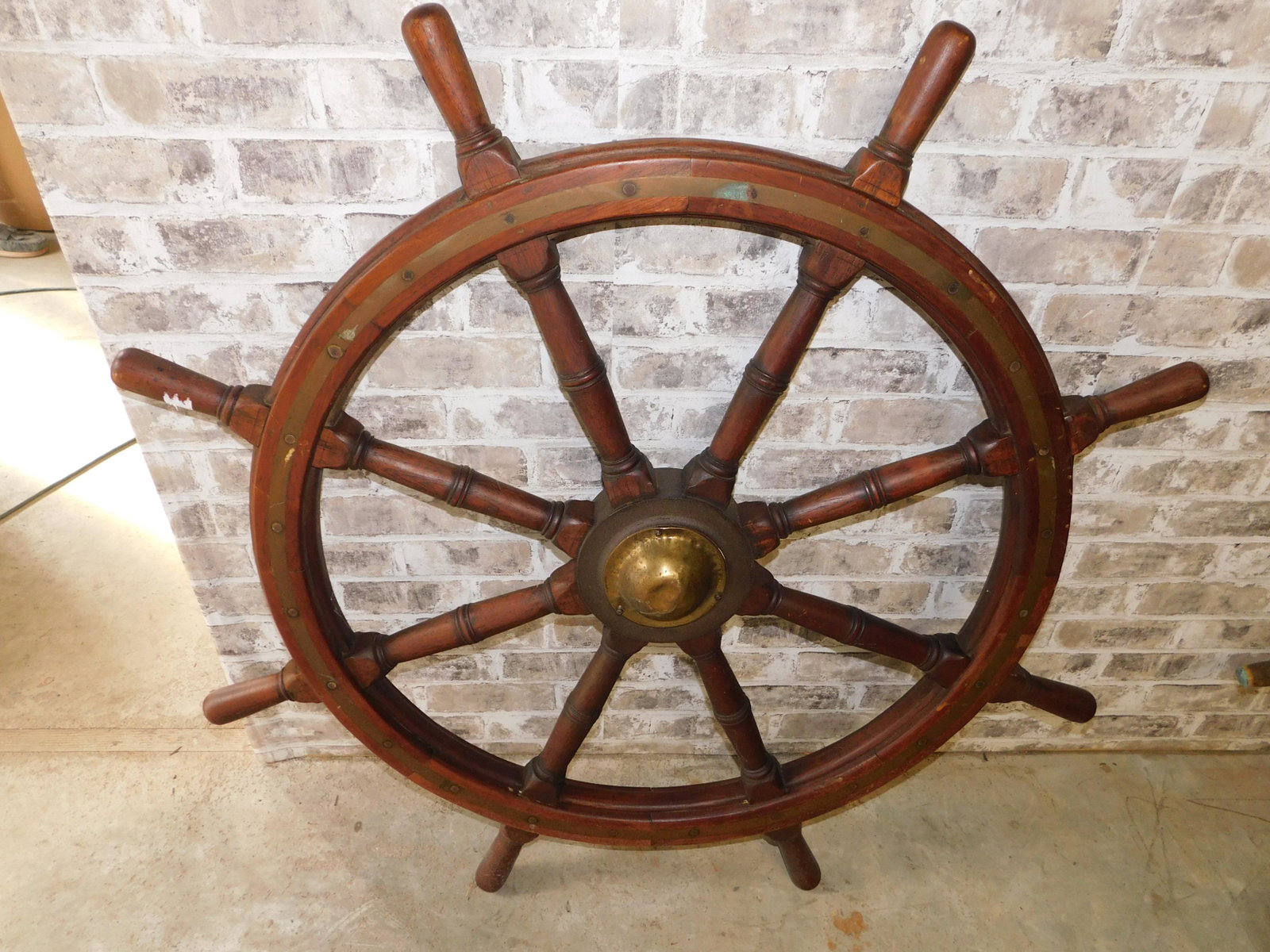 Wooden Ship's Wheel: Wooden Ship's Wheel. Measures 44" diameter. You are bidding at a live sale. Please read the terms and conditions. This sale will be broadcast live on sale day with full descriptions of each lot being 