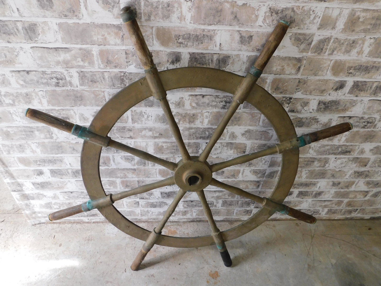 Brass Ship's Wheel: Brass Ship's Wheel. Measures 41" diameter. You are bidding at a live sale. Please read the terms and conditions. This sale will be broadcast live on sale day with full descriptions of each lot being s