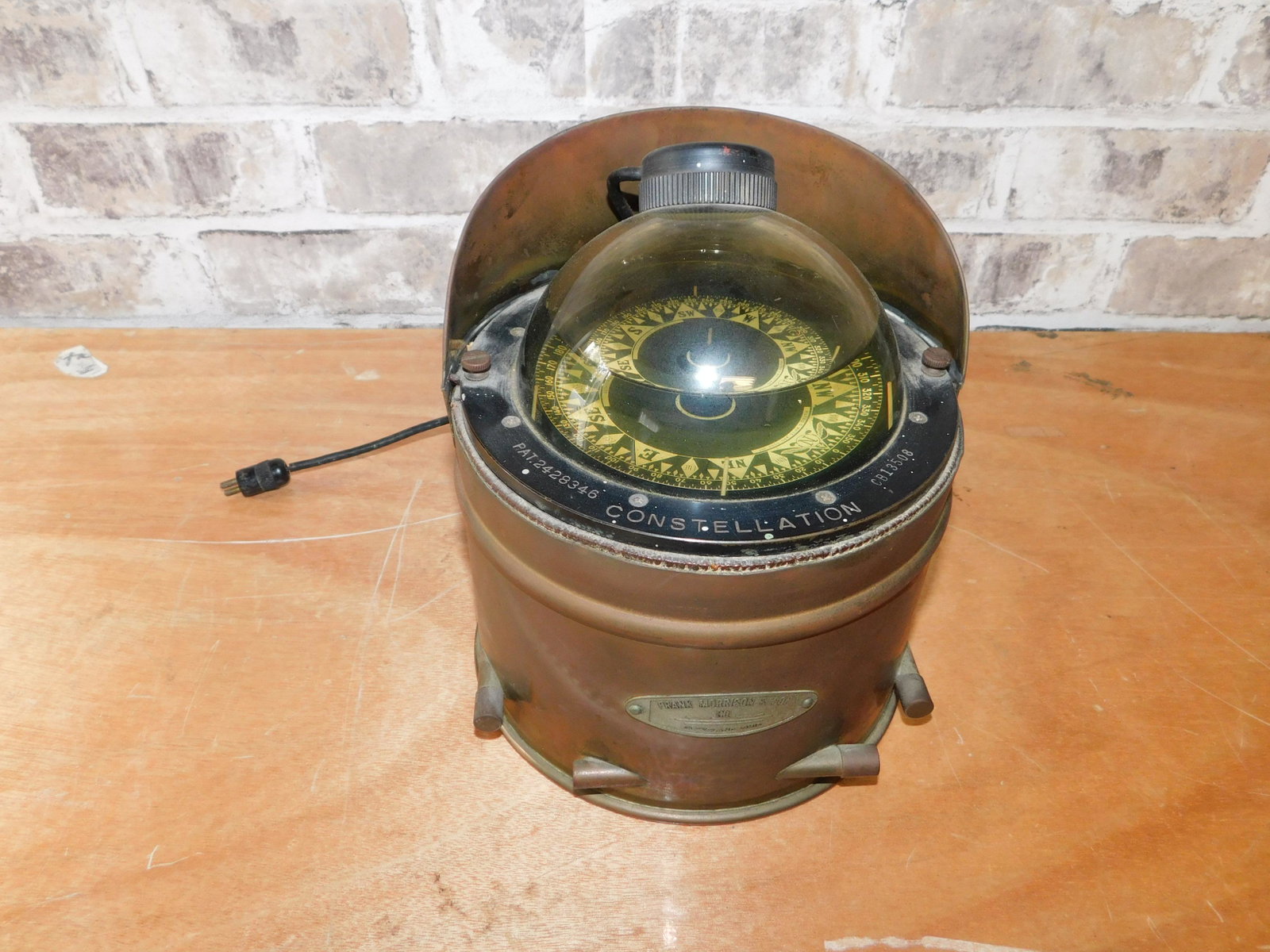 Frank Morrison & Sons Boat Compass: Frank Morrison & Son Copper Boat Compass. Constellation. Measures 8" tall. You are bidding at a live sale. Please read the terms and conditions. This sale will be broadcast live on sale day with full 