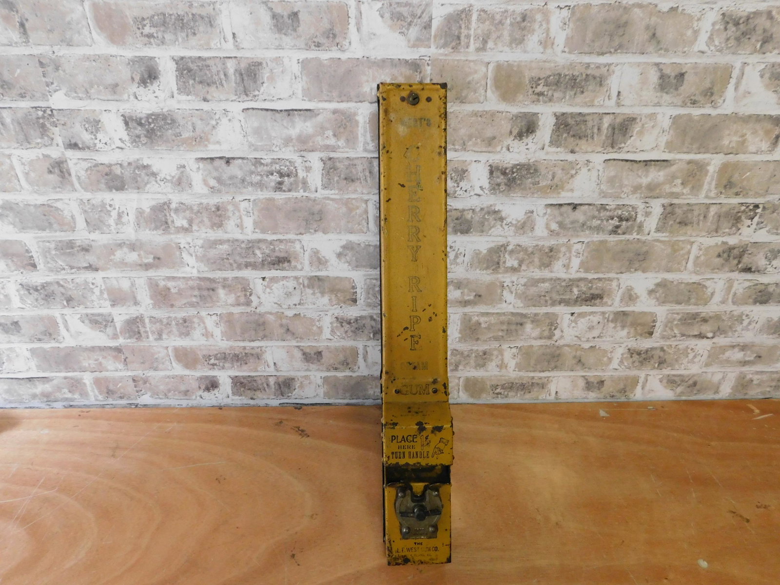 West's Gum Machine: West's Cherry Ripe Cream Gum. One set Coin Operated Wall Hanging Gum Machine. Measures 24" tall. You are bidding at a live sale. Please read the terms and conditions. This sale will be broadcast live 