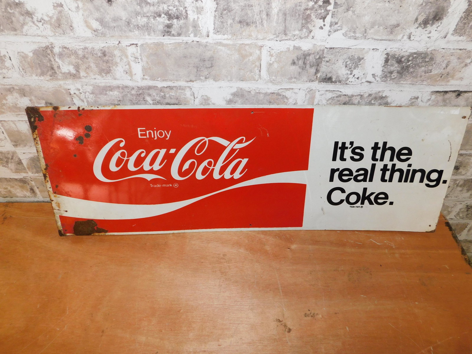 Coca Cola Tin Sign: Coca-Cola Tin Sign. Has Rusting. Measures 27.5" x 9.5" wide. You are bidding at a live sale. Please read the terms and conditions. This sale will be broadcast live on sale day with full descriptions o