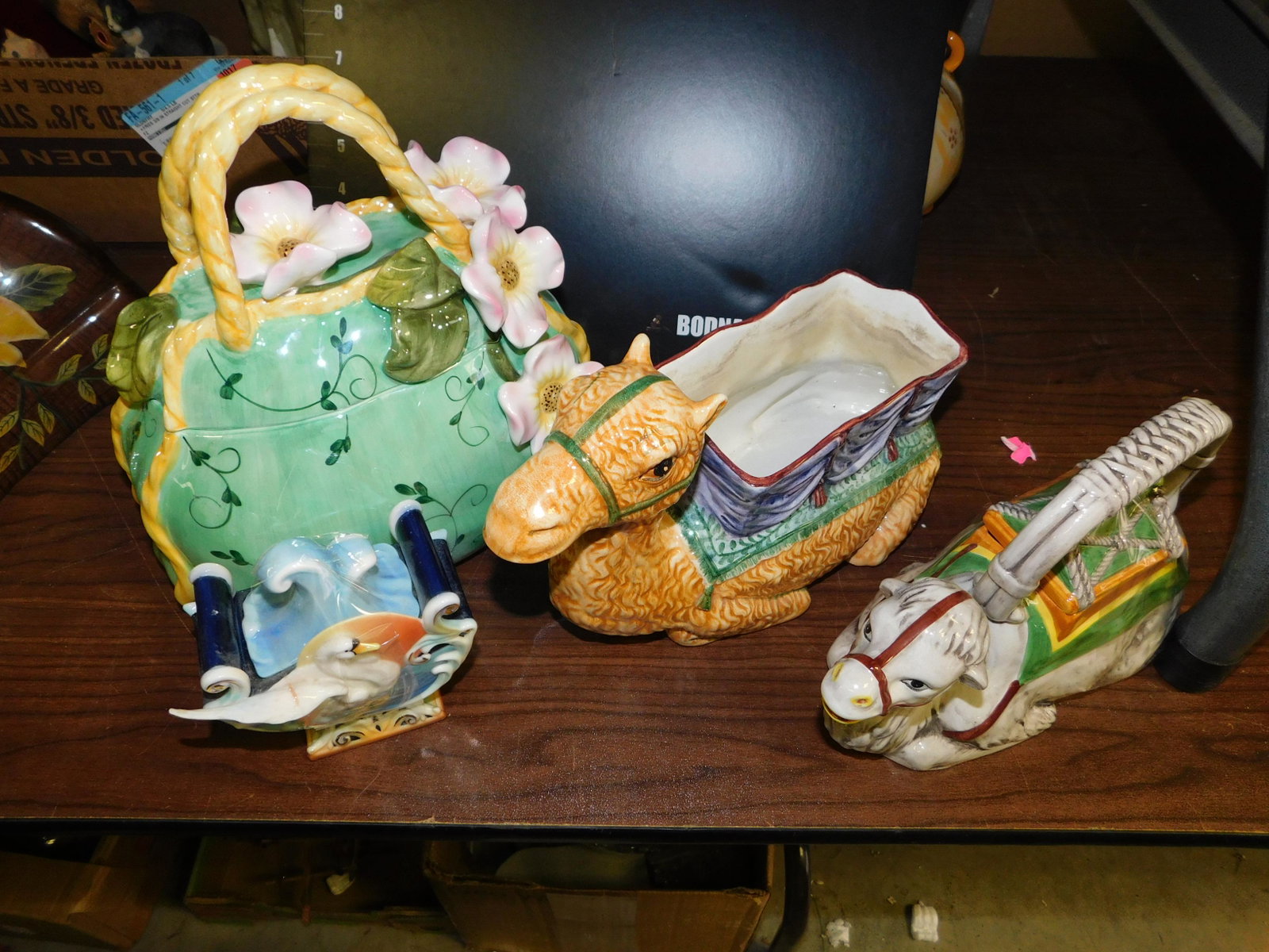 Lot of 4 Decorative Pieces: Lot of 4 Decorative Pieces including Camel Made in Italy, Camel Teapot, Franz Covered Sugar and Pocket Book Cookie Jar. You are bidding at a live sale. Please read the terms and conditions. This sale 