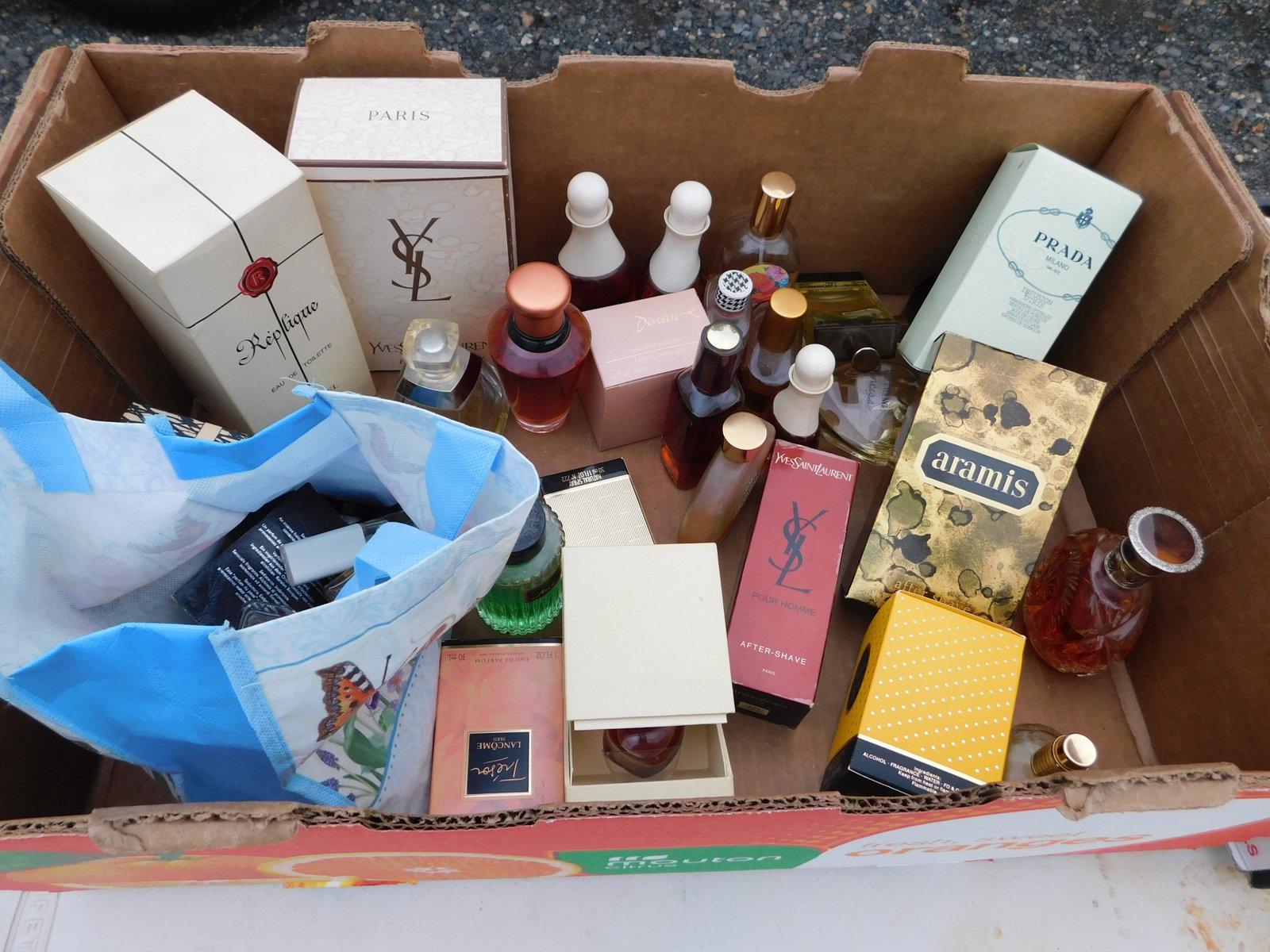 Large Lot of Perfume: Large Lot of Perfume. Including Prada, Christian Dior and Yves St Laurent. You are bidding at a live sale. Please read the terms and conditions. This sale will be broadcast live on sale day with full 