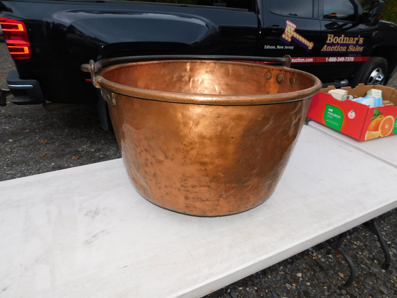 Large Copper Kettle: Large Copper Kettle. You are bidding at a live sale. Please read the terms and conditions. This sale will be broadcast live on sale day with full descriptions of each lot being sold, as well as video 