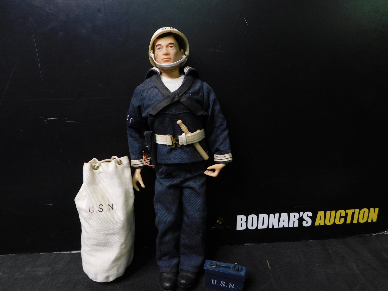 Vintage G.I. Joe 12" Figure: Vintage 12" G.I. Joe Figure. Marked 1964. Comes with Accessories. Navy. You are bidding at a live sale, please read the terms and conditions. We are offering contact-less pick ups at our South Brunswi
