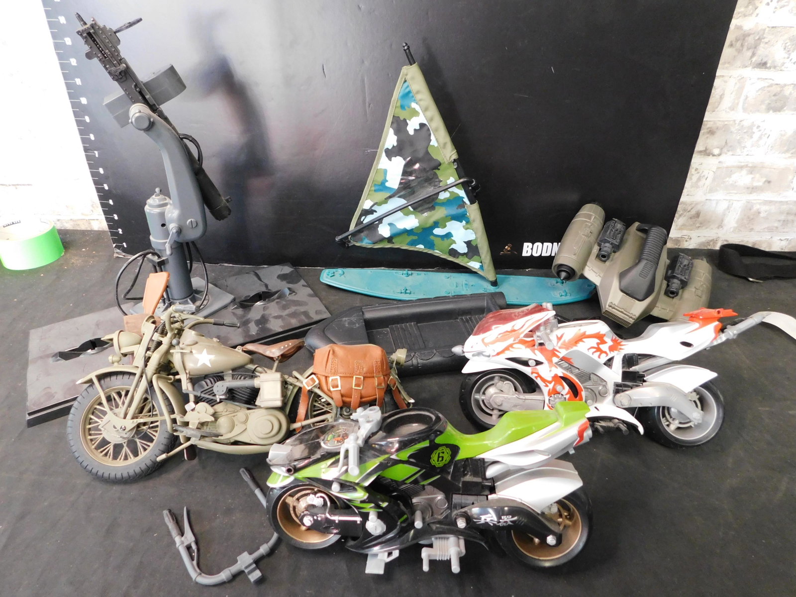 Box Lot with GI Joe Motorcycles, Boats, Vehicles: Box Lot with GI Joe Motorcycles and Boats and Vehicles. You are bidding at a live sale, please read the terms and conditions. We are offering contact-less pick ups at our South Brunswick location by A