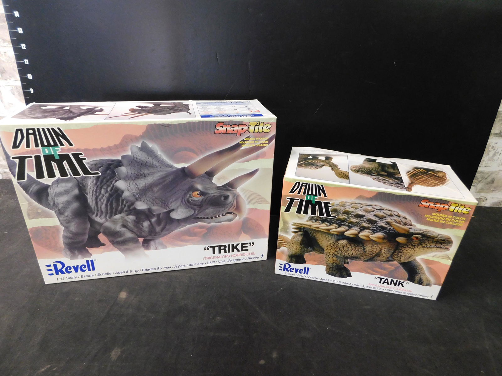 Lot of 2 Dawn of Time Dinosaur Model Kits - "Tank" and: Lot of 2 Revell Dawn of Time Dinosaur Model Kits. Included are "Tank" and "Trike" All from private collector who disclosed to us that he just took off the factory seal to look at them and to the best