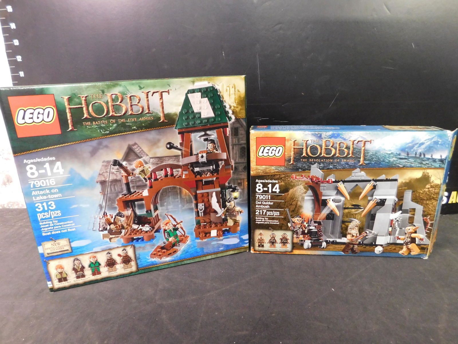 Lego The Hobbit Lot of 2 - Attack on Lake-Town and Dol: Lego The Hobbit Lot of 2. Included in this lot are Dol Guldur Ambush and Attack on Lake Town. The Legos came from a collector's estate. He had them displayed and for selling purposes he took them apar