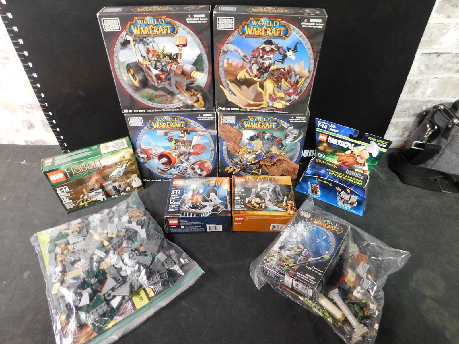 Box Lot of Legos and Mega Bloks: Box Lot of Legos and Mega Bloks. This box includes The Hobbit, Lord of the Rings and World of Warcraft. The Legos came from a collector's estate. He had them displayed and for selling purposes he took