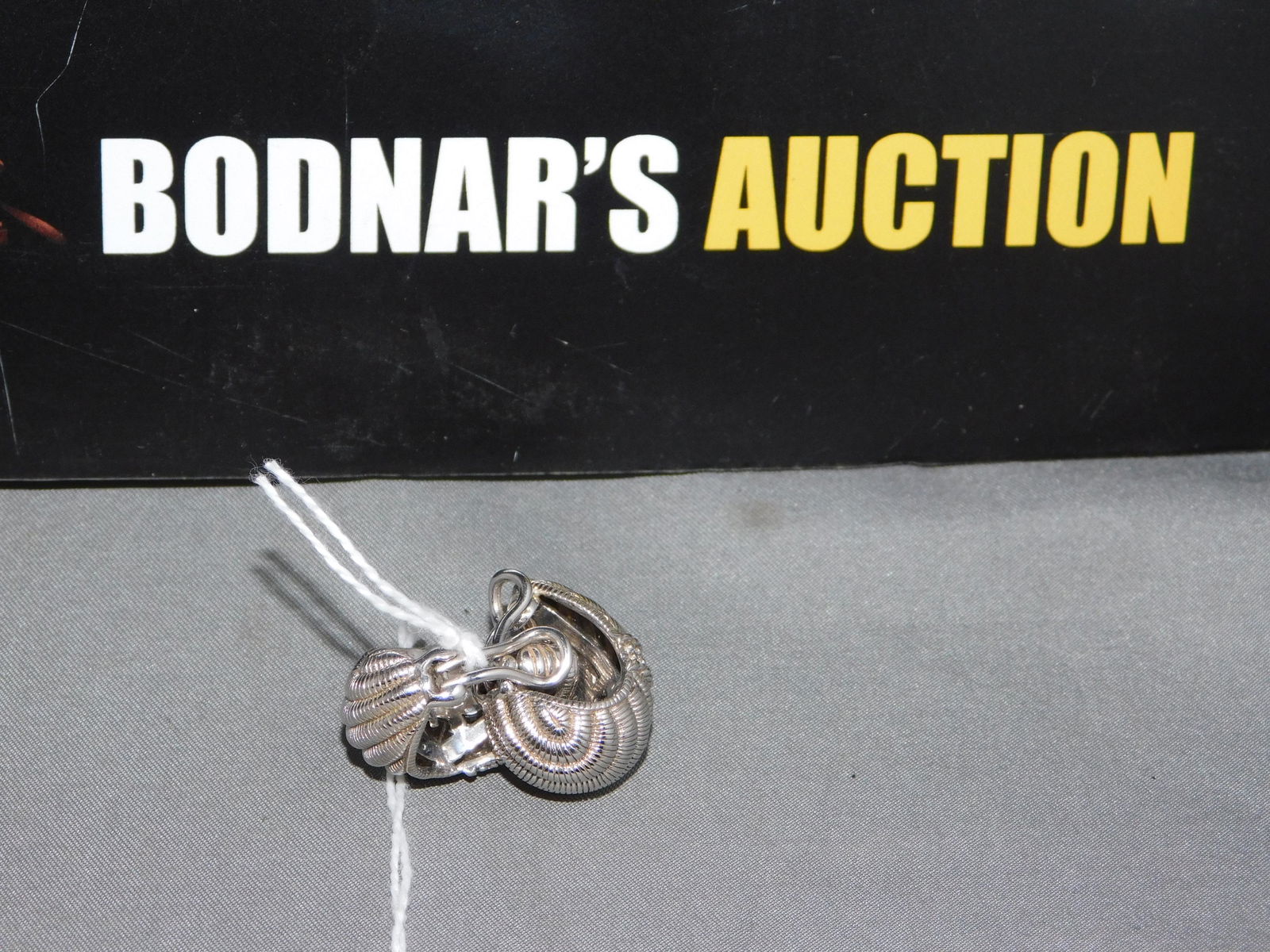 Judith Ripka Sterling CZ Earrings: Judith Ripka sterling silver & cz/cubic zirconia hoop clip earrings. Measures 3/4" long. Marked on the back. You are bidding at a live sale, please read the terms and conditions. We are offering conta