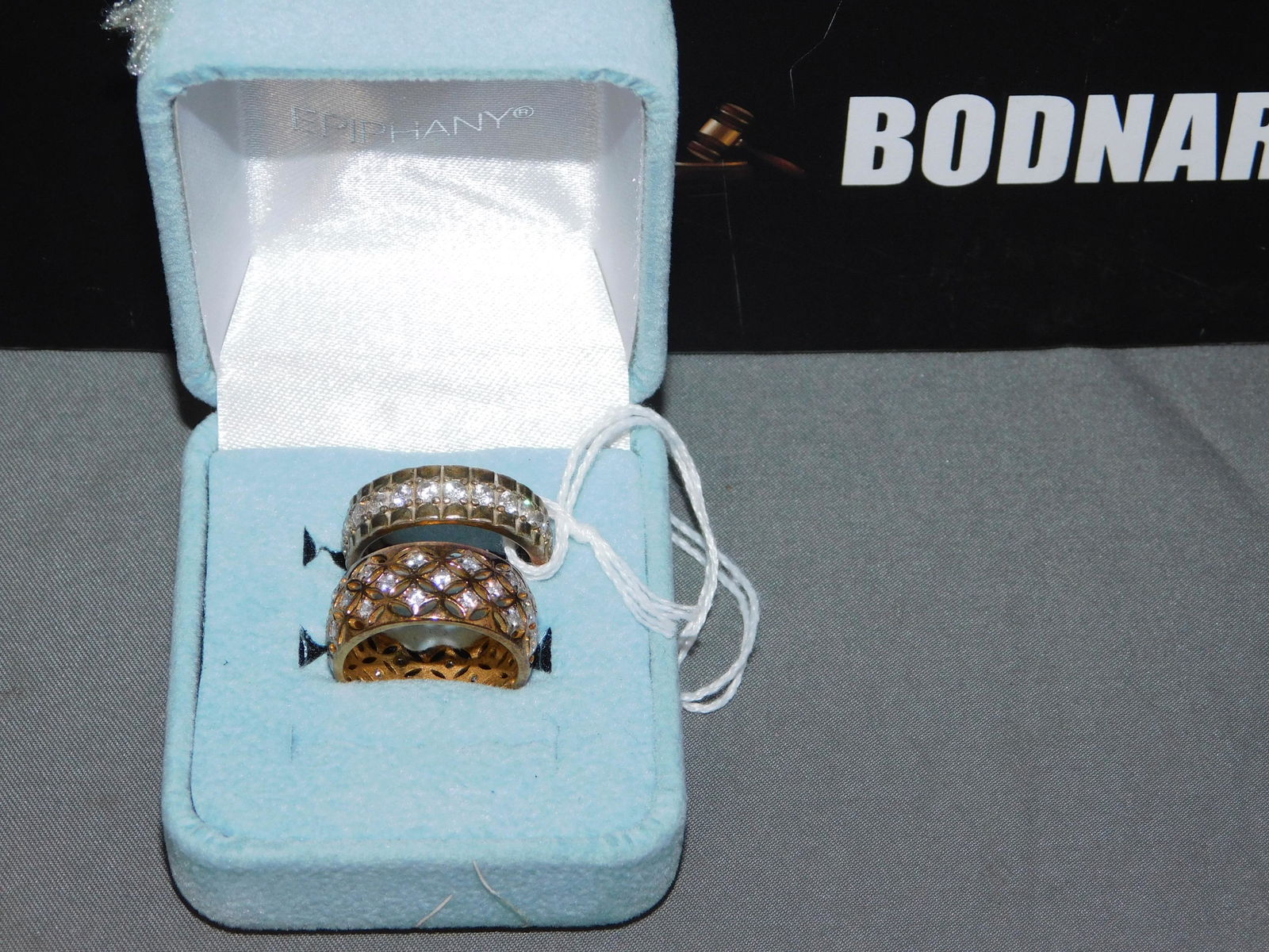 2 Sterling Cubic Zirconia Bands: 2 sterling silver gold vemeil and cubic zirconia bands. Size 7. Marked on the inside. You are bidding at a live sale, please read the terms and conditions. We are offering contact-less pick ups at our