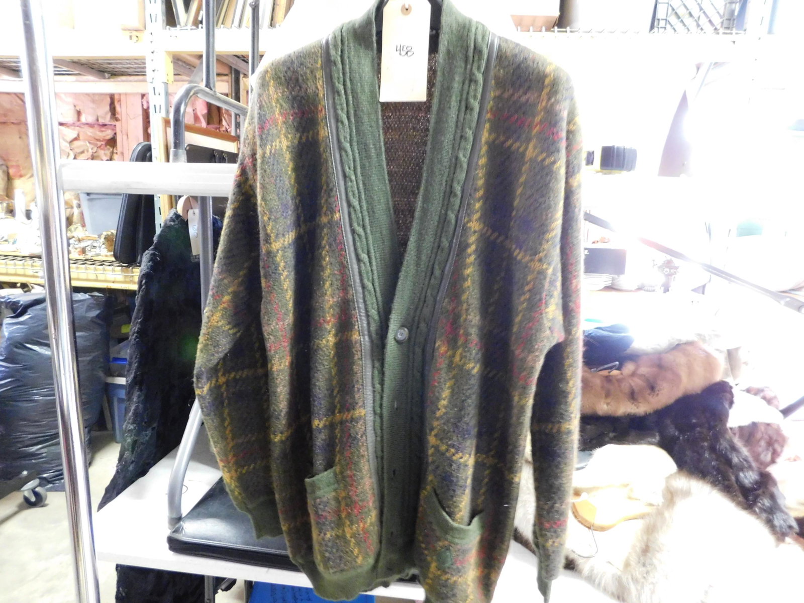 Yves St. Laurent Plaid Sweater: Yves St. Laurent Plaid Sweater. Labeled Size 6. Measures 31" L x 21" W. We are offering contact-less pick ups at our South Brunswick location by APPOINTMENT ONLY on the Friday, Saturday, Monday and Tu