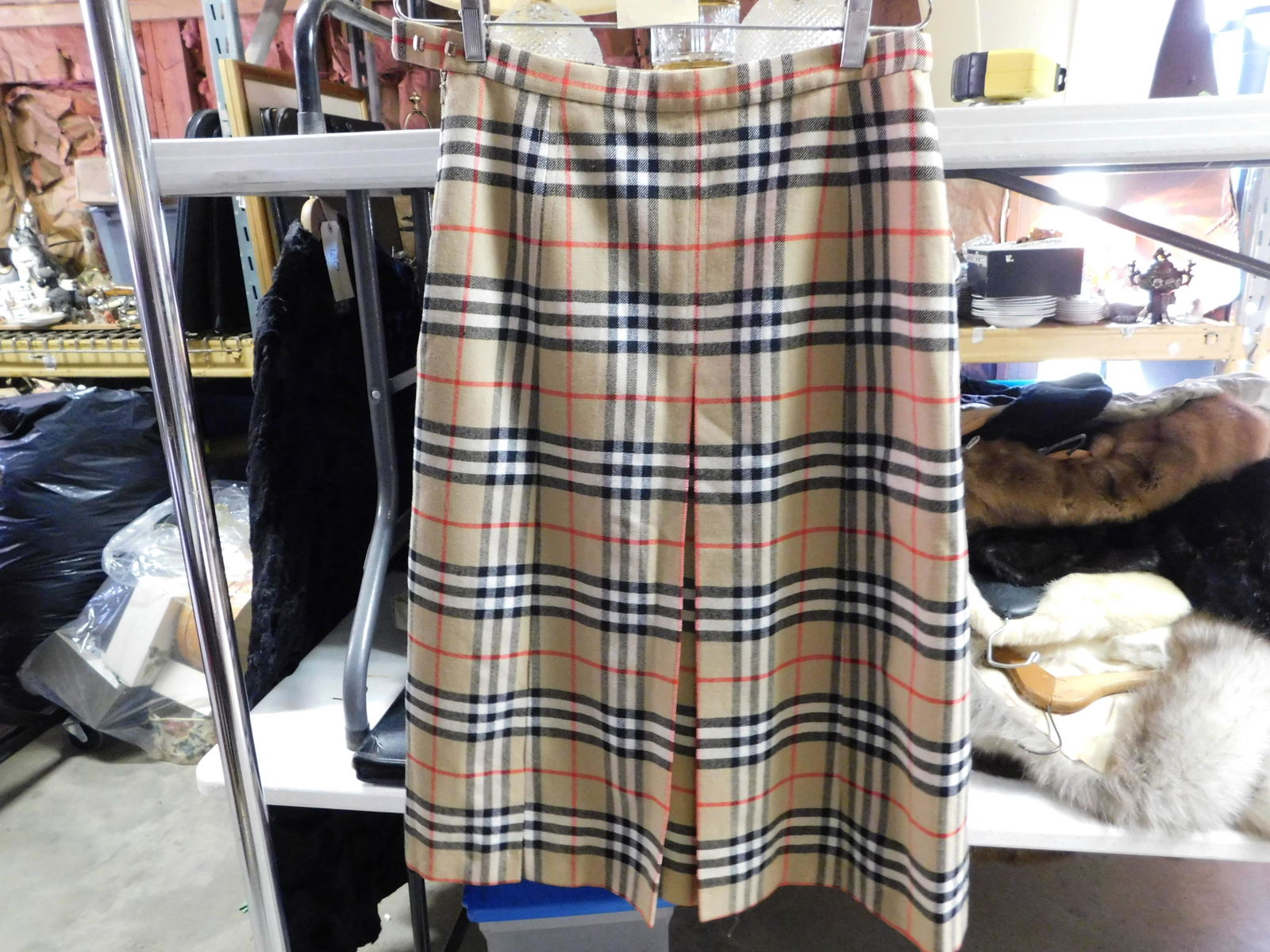 Burberrys' Plaid Wool Skirt: Burberrys' Plaid Wool Skirt. No Size Listed. Measures 28.5" L x 14.5 Waist. We are offering contact-less pick ups at our South Brunswick location by APPOINTMENT ONLY on the Friday, Saturday, Monday an