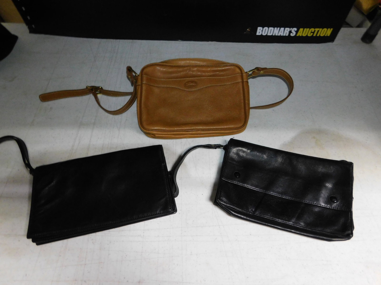 Lot of Longchamp Leather Purses: Lot of Longchamp Leather Purses. We are offering contact-less pick ups at our South Brunswick location by APPOINTMENT ONLY on the Friday, Saturday, Monday and Tuesday immediately following the sale. Y
