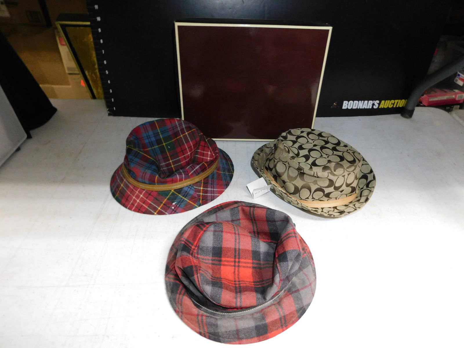 3 Coach Hats: 3 Coach Hats. 2 with tags. 1 has a couple small holes. We are offering contact-less pick ups at our South Brunswick location by APPOINTMENT ONLY on the Friday, Saturday, Monday and Tuesday immediately