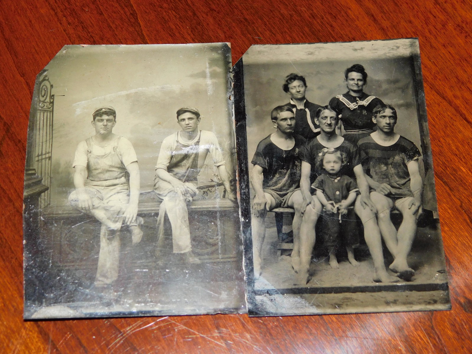 2 Interesting Tintypes: 2 tintypes. The first has 2 men in their work overalls and the second is a family in their swimsuits. Both are in good condition with normal wear. Measures approx. 3 1/2" tall x 2 1/4" wide. You are b