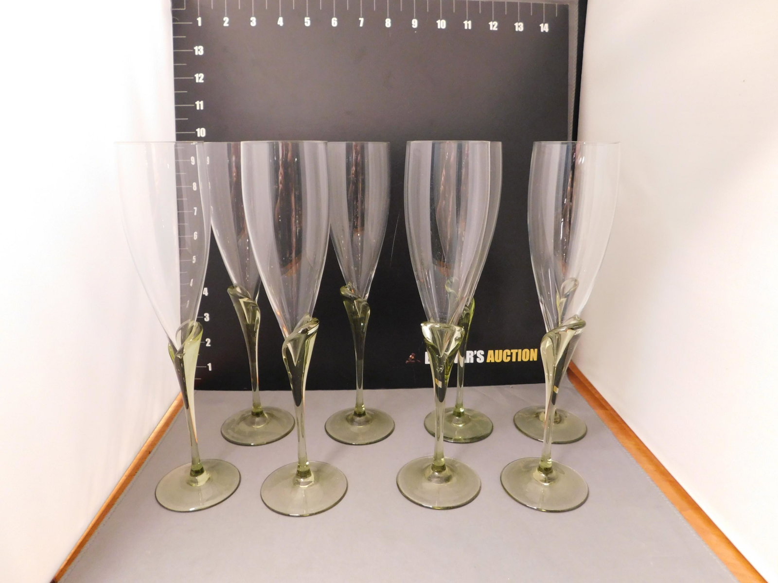 Set of 8 Rosenthal Champagne Glasses: Set of 8 Rosenthal champagne glasses in clear and green glass. All in very good condition. Measures approx. 9 1/2" tall x 2" wide. Set of 12 Moser wine glasses, custom made pattern, not available in t