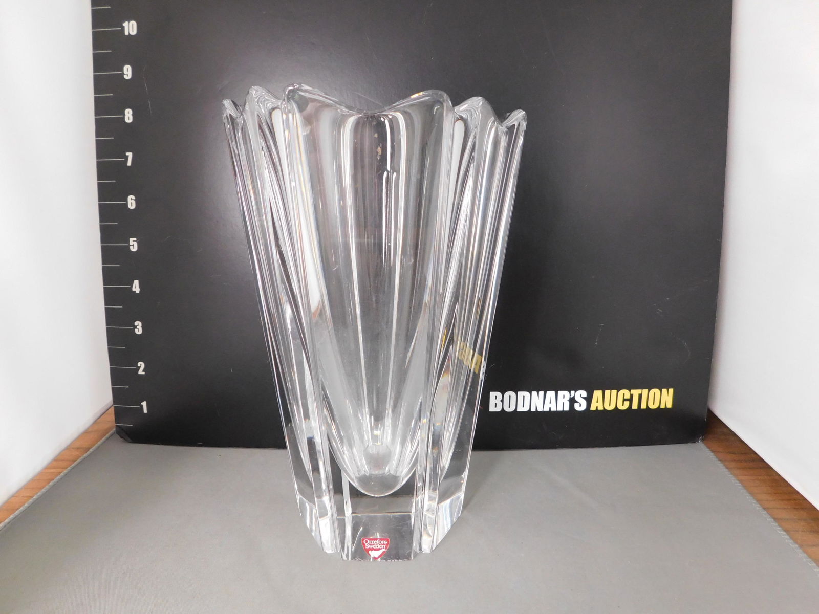 Orrefors Tall Vase: Signed Orrefors Tall Vase. Measures 8" tall x 5" d. You are bidding at a live sale, please read the terms and conditions. We are offering contact-less pick ups at our South Brunswick location by APPOI