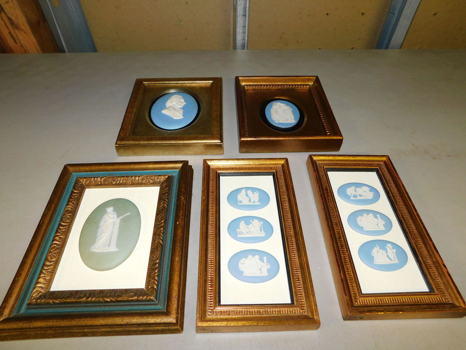 Lot of 5 Framed Wedgewood Jasper Plaques: Lot of 5 Framed Blue and Green Wedgewood Jasper Plaques. Measures 6.5" x 7.5" and 5" x 9.5". You are bidding at a live sale, please read the terms and conditions. We are offering contact-less pick ups