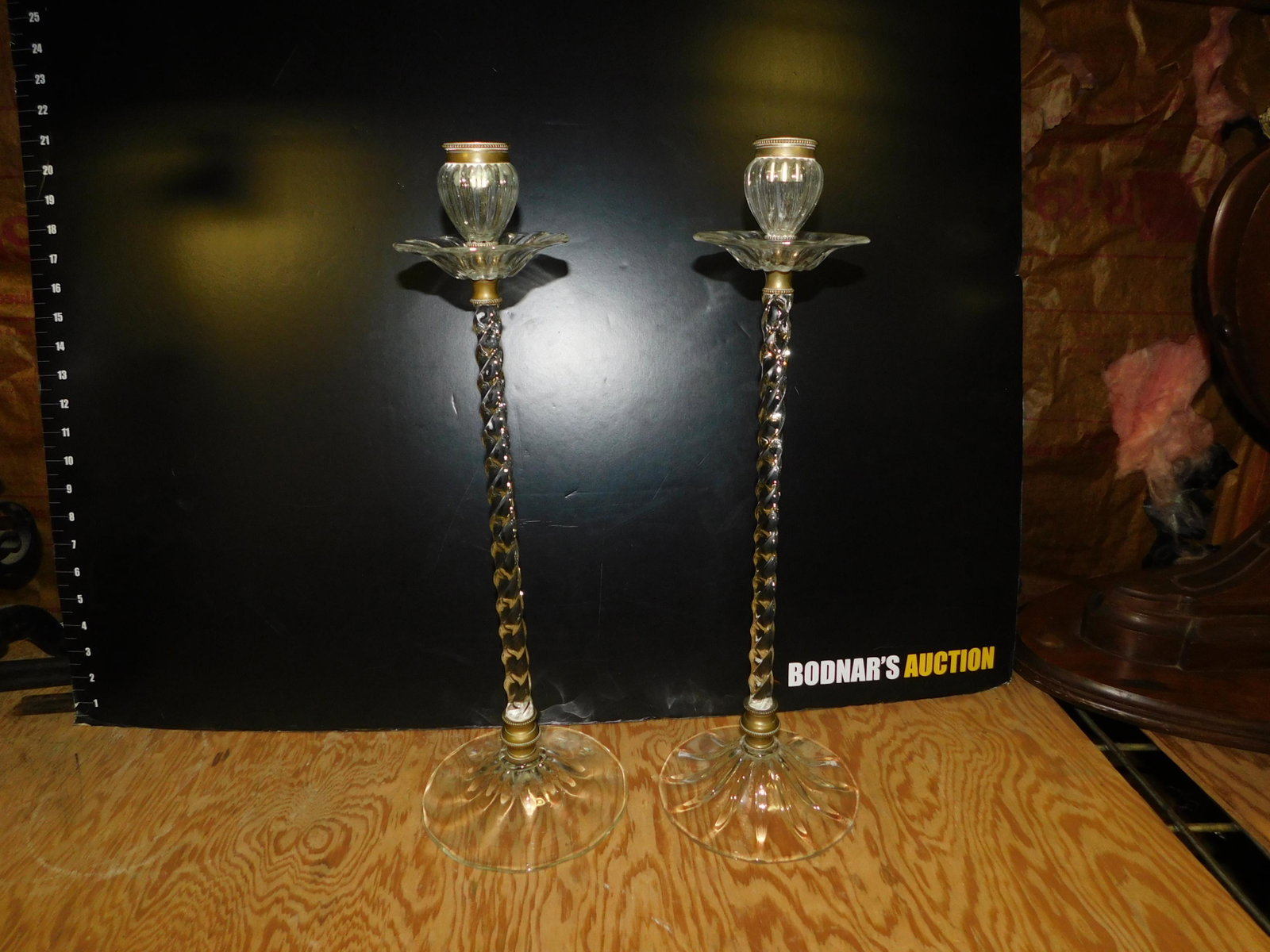 Pair of Elegant Glass Candlesticks: Pair of Elegant Glass Candlesticks in the manner of Webb. Measures 20" tall. You are bidding at a live sale, please read the terms and conditions. We are offering contact-less pick ups at our South Br