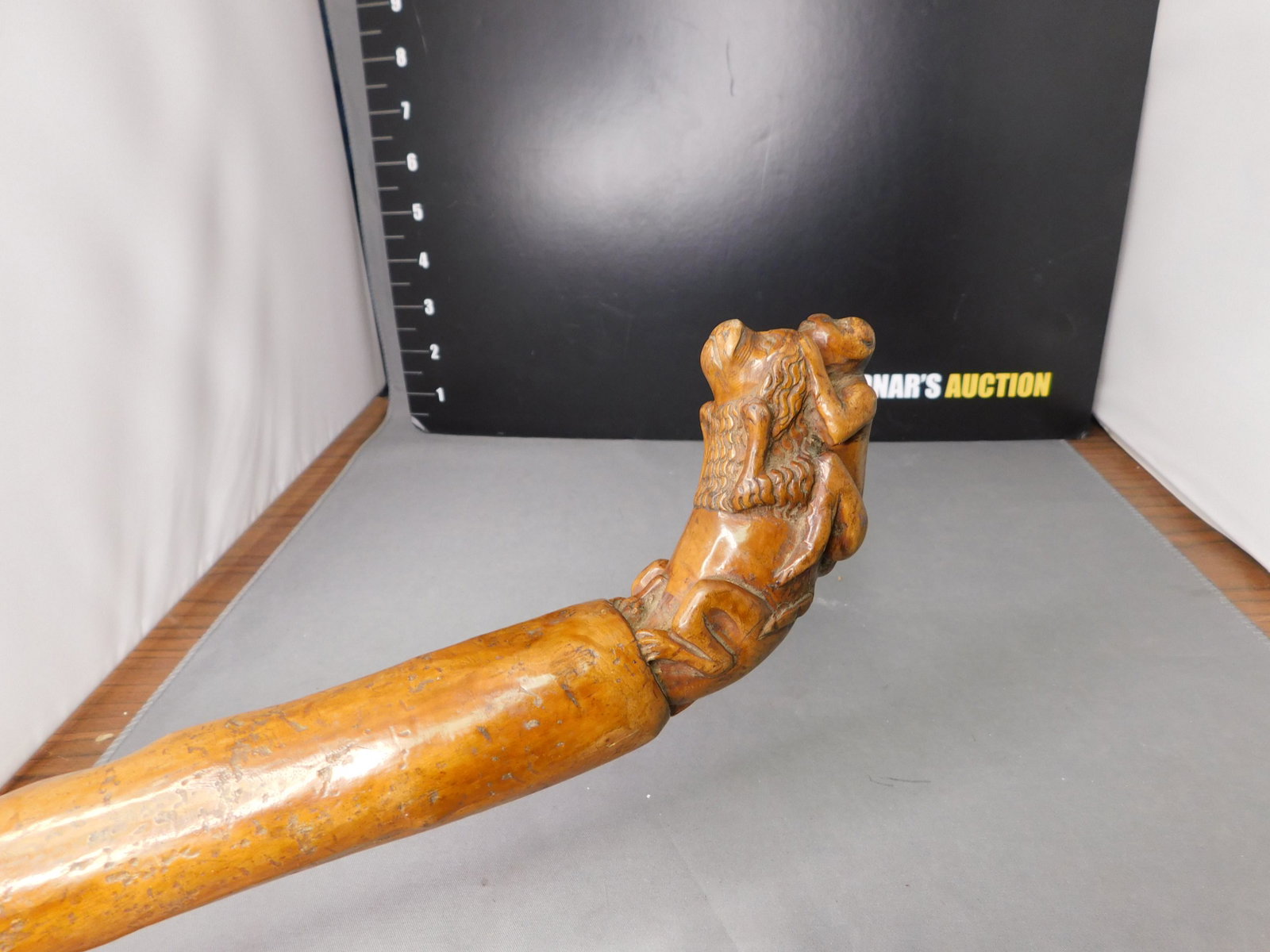 Vintage Walking Stick with Hand carved Dog and Monkey: Vintage Walking Stick Hand carved with Dog and Monkey on his back. Measures 36" long. You are bidding at a live sale, please read the terms and conditions. We are offering contact-less pick ups at our