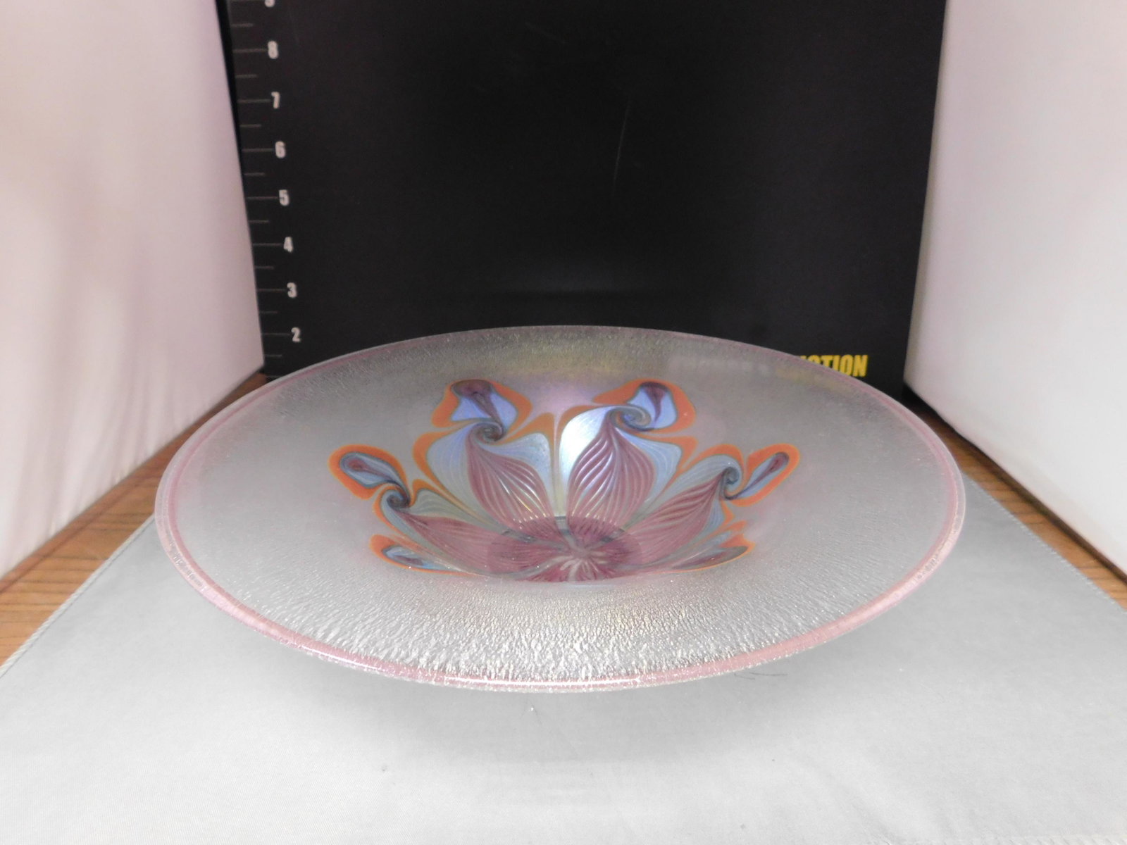 Vandermark Art Glass Bowl: Vandermark Studio Art Glass Bowl. Stretch Glass Quezal Style. Measures 10" diameter. You are bidding at a live sale, please read the terms and conditions. We are offering contact-less pick ups at our 