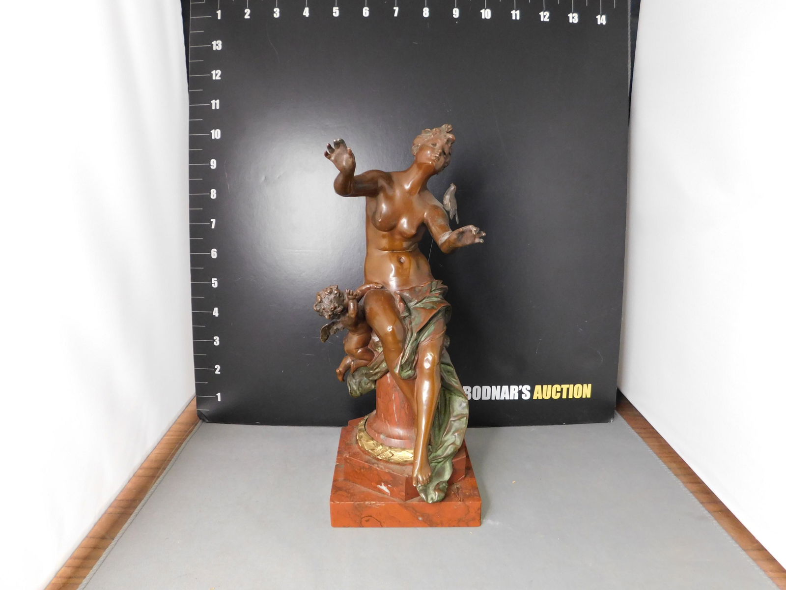 Antique Bronze Statue of Nude Woman and Cherub: Fine Antique Bronze Statue. Nude Woman with Cherub on Marble Base. Cold Painted Artist Signed - Appears to be...Heei '98. Measures 10" tall x 4" long. You are bidding at a live sale, please read the t