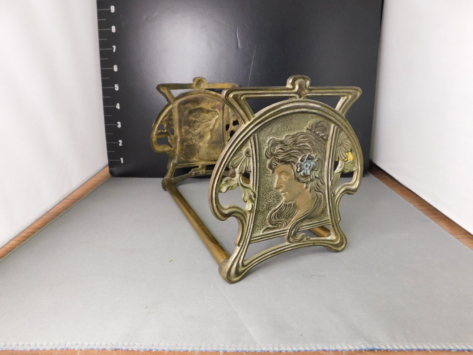 Art Nouveau Adjustable Slide Book Holder: Art Nouveau Adjustable Slide Book Holder. Measures 5.5" tall x 9" long. You are bidding at a live sale, please read the terms and conditions. We are offering contact-less pick ups at our South Brunswi