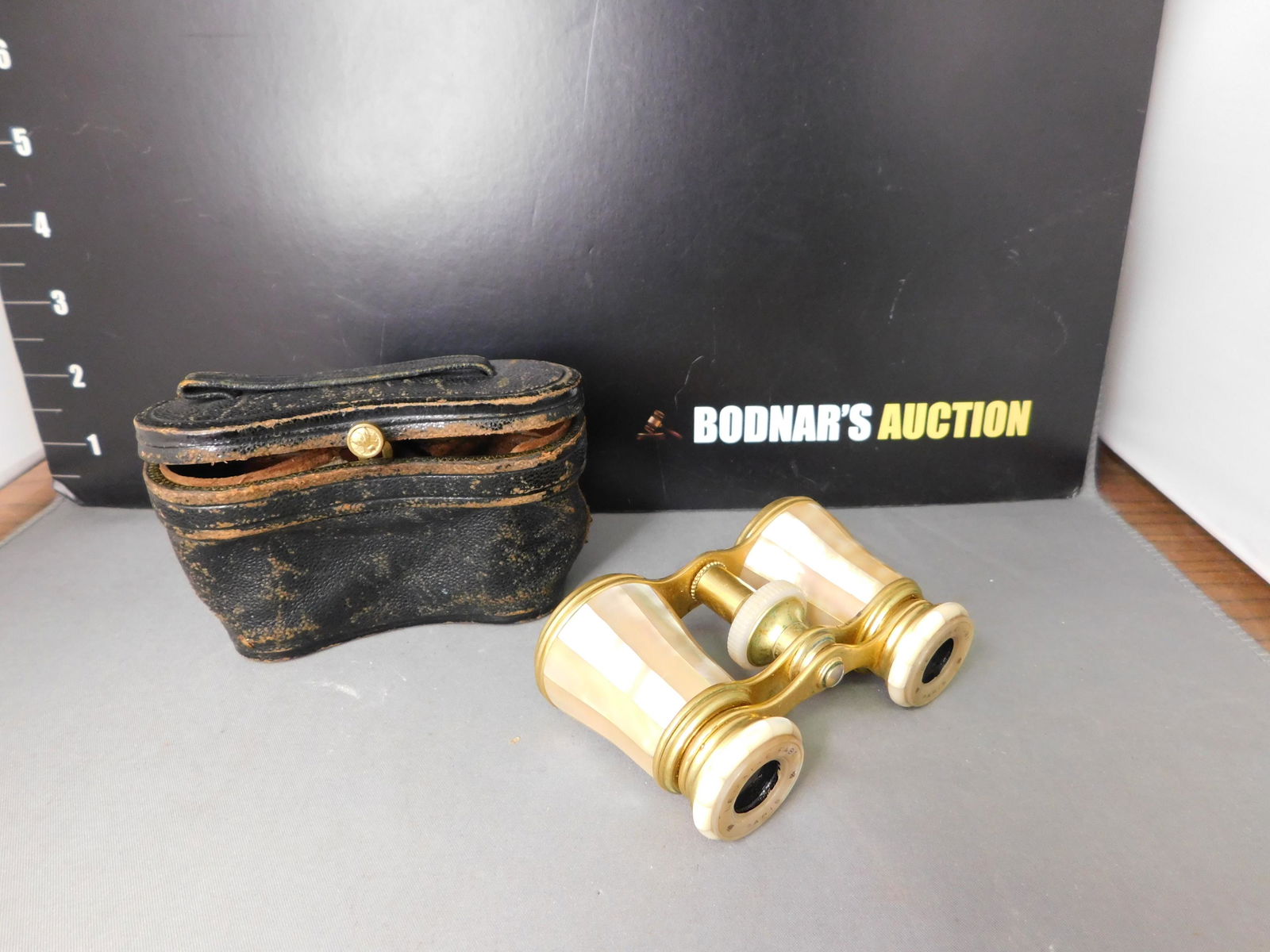 French Victorian Mother of Pearl Opera Glasses with: French Victorian Mother of Pearl Opera Glasses with Original Case. Marked Lemaire Fabi Paris. Measures 3.75" long x 2.25". You are bidding at a live sale, please read the terms and conditions. We are