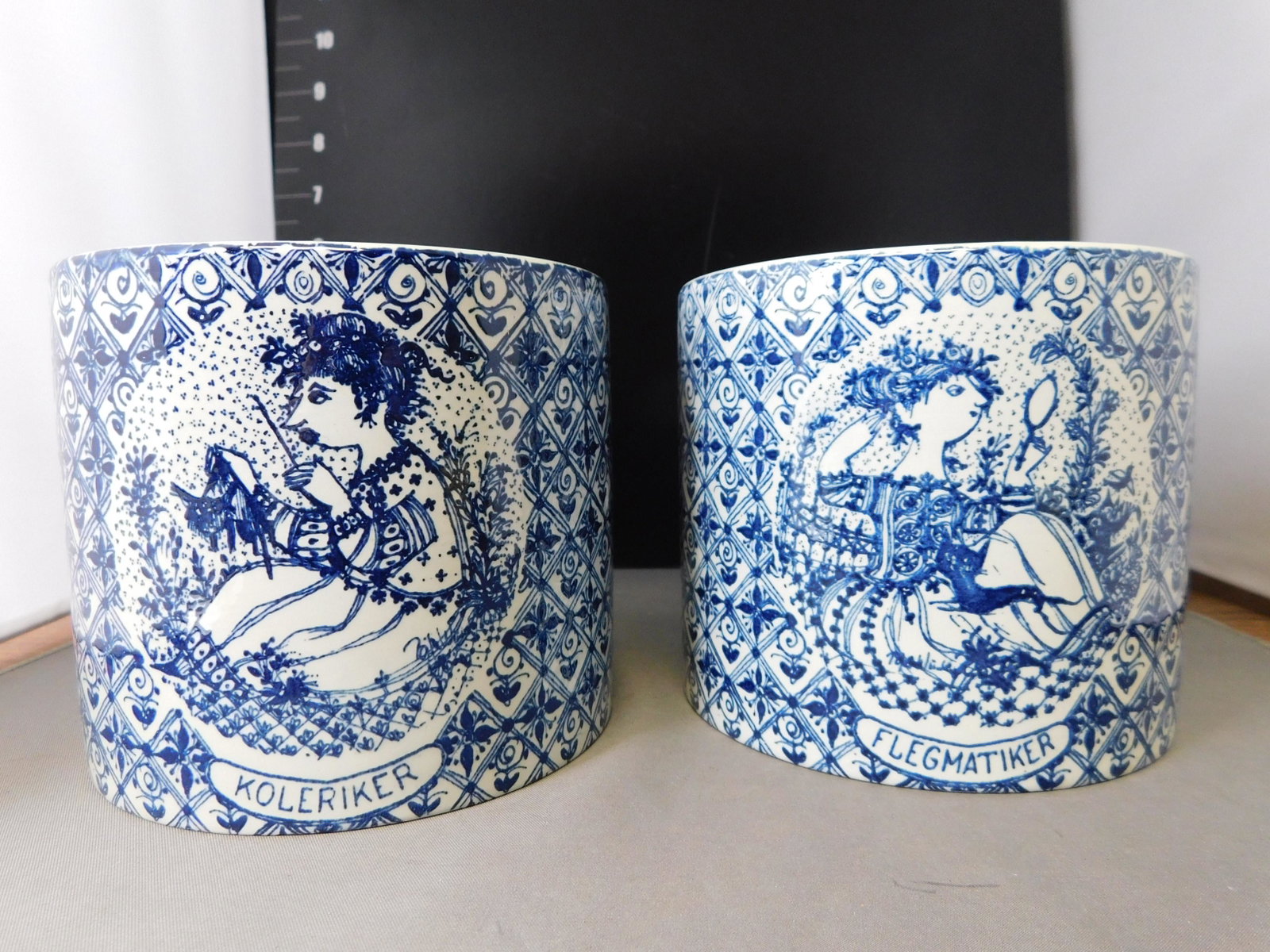Pair of Mid Century Modern Vase: Pair of Mid Century Modern Blue and White Ceramic Vase by Nymolle Denmark Artists Bjorn Wamblad. Measures 4.25" t X 5" d. You are bidding at a live sale, please read the terms and conditions. We are o