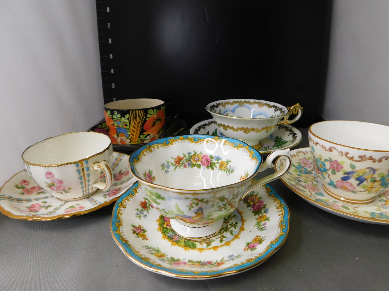 Teacup and Saucer Group Lot of 5: Lot of 5 Teacups and Saucers. JC Klenec, Royal Chelsea, Staffordshire, Royal Albert and Minton. You are bidding at a live sale, please read the terms and conditions. We are offering contact-less pick 