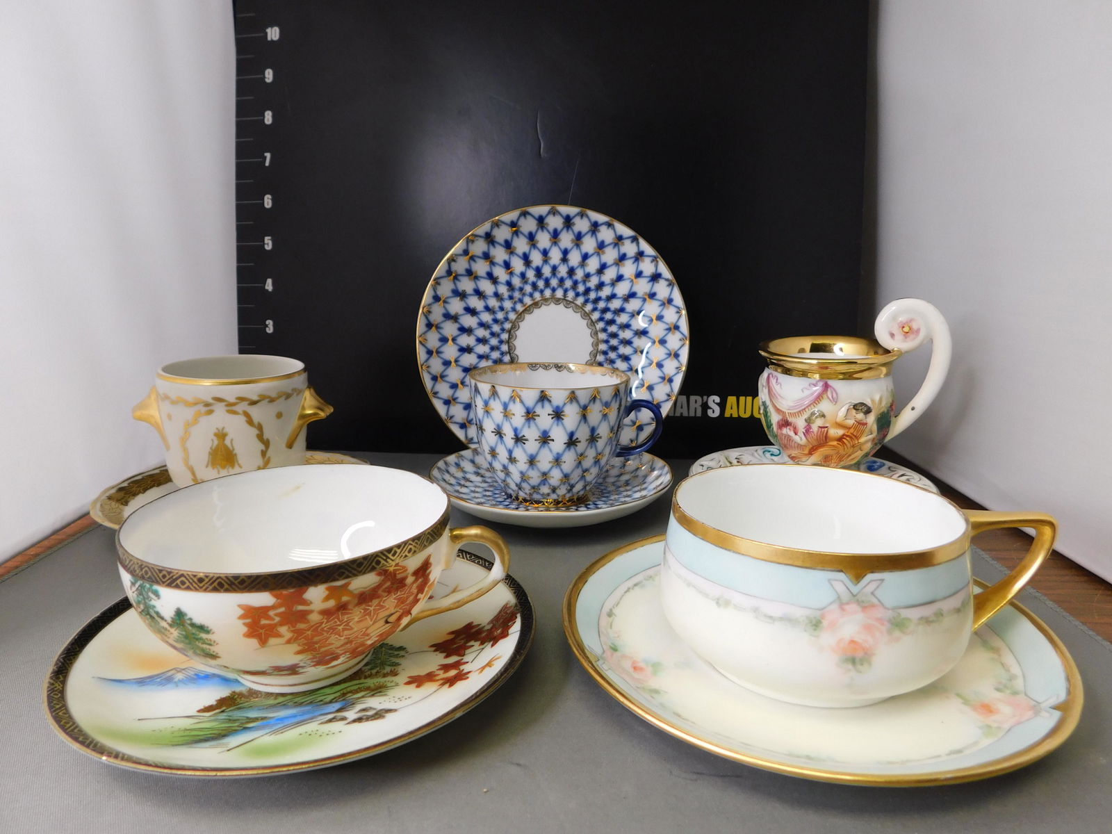 Teacup and Saucer Group Lot of 5: Lot of 5 Teacups and Saucers with One Snack Plate. Included in this lot are a Made in Russia, Rosenthal, Chinese, Limoges and Capodimonte. You are bidding at a live sale, please read the terms and con