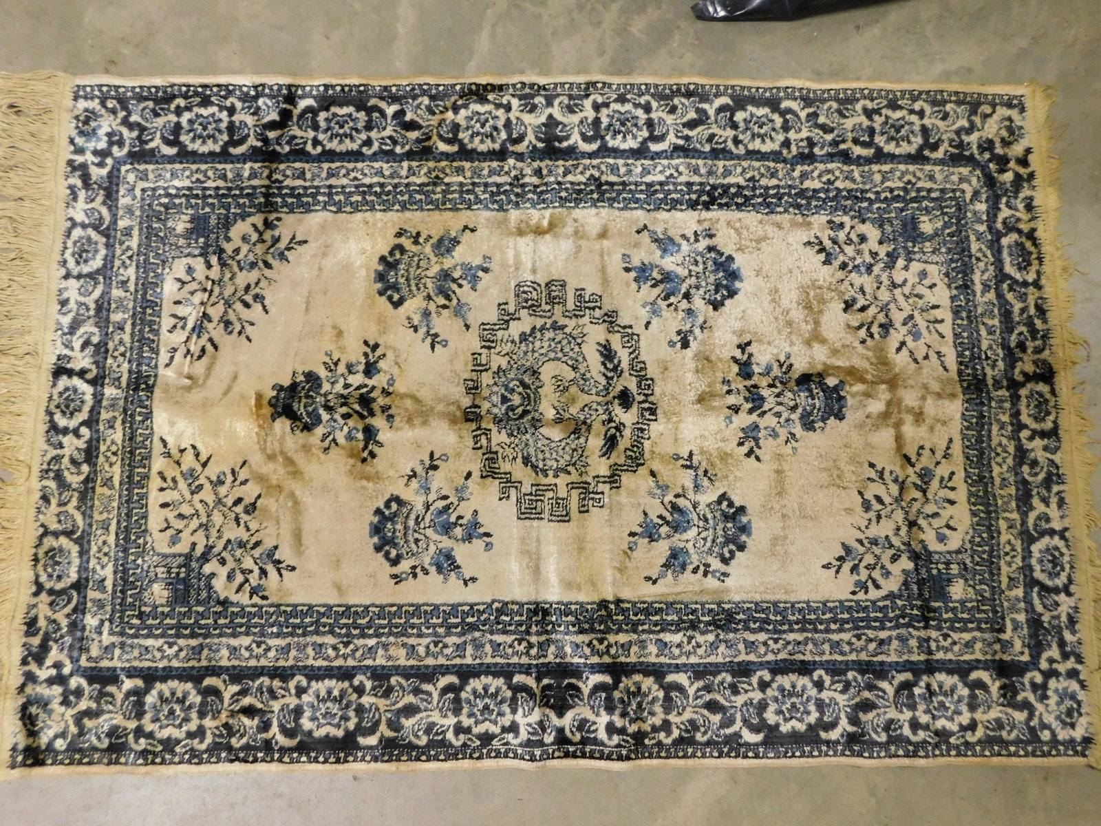 Chinese Silk Prayer Rug: Chinese Silk Prayer Rug. Off White and Blue. Measures 25.5" x 38" Some Loss to Fringe. You are bidding at a live sale, please read the terms and conditions. We are offering contact-less pick ups at ou