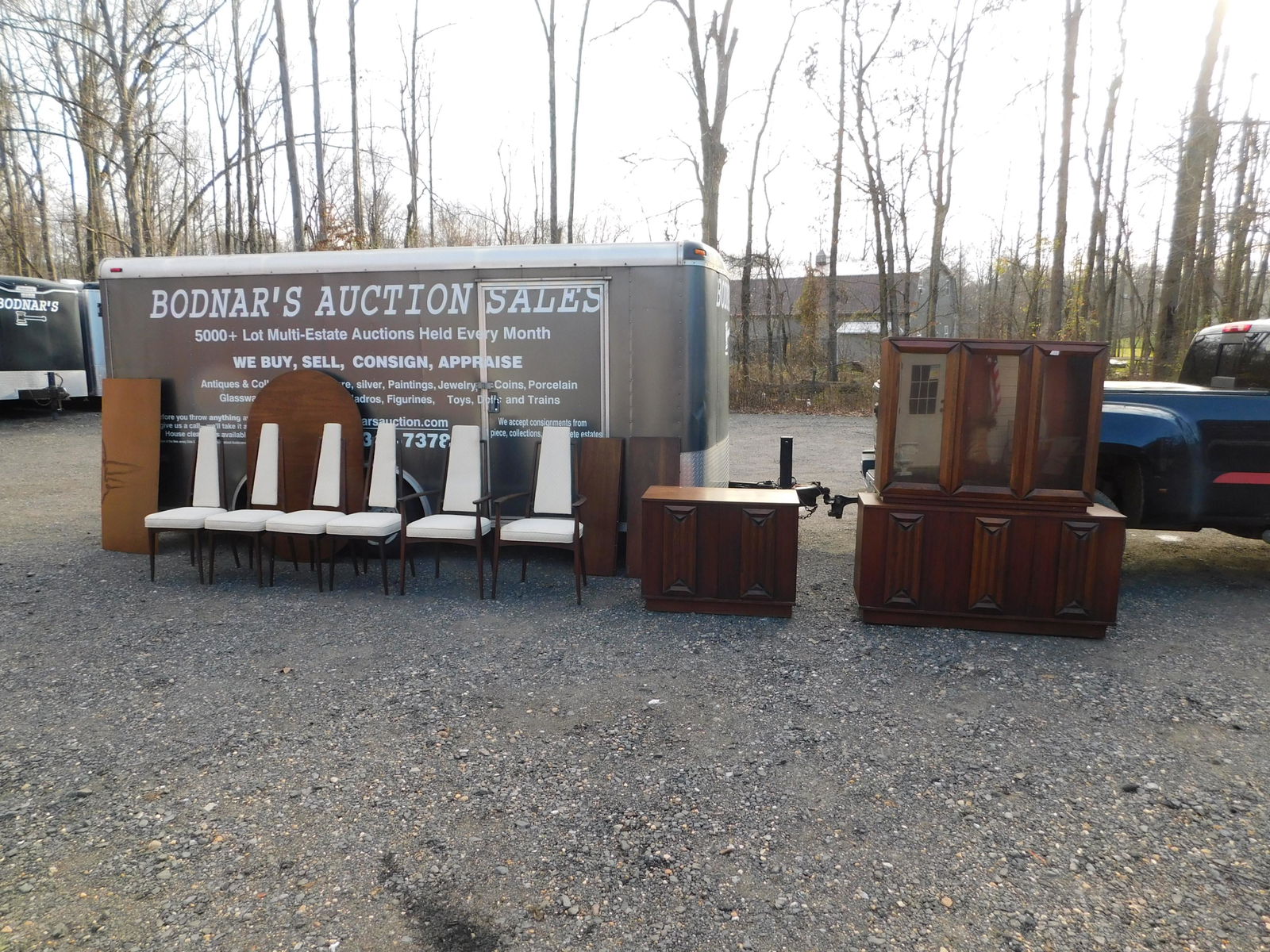 Mid-Century Modern dining room set: 9-piece Mid-Century Modern dining room set, set contains a table with 6 chairs, 2-piece china closet and a server. Some chairs need the back reattached, one of the swing out doors is as is, table side