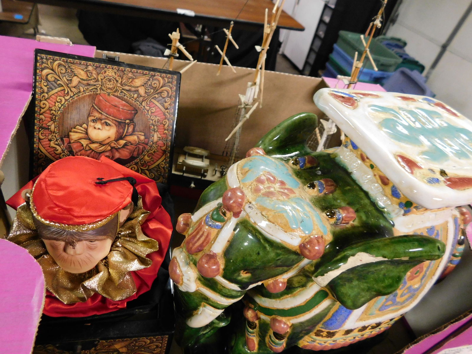 Box Lot of Monkey and Ship Model: Box Lot with Planter and Monkey in the Box and Model Ship. This sale will be broadcast live on sale day with full descriptions of each lot being sold, as well as video feed of each lot. All items MUST