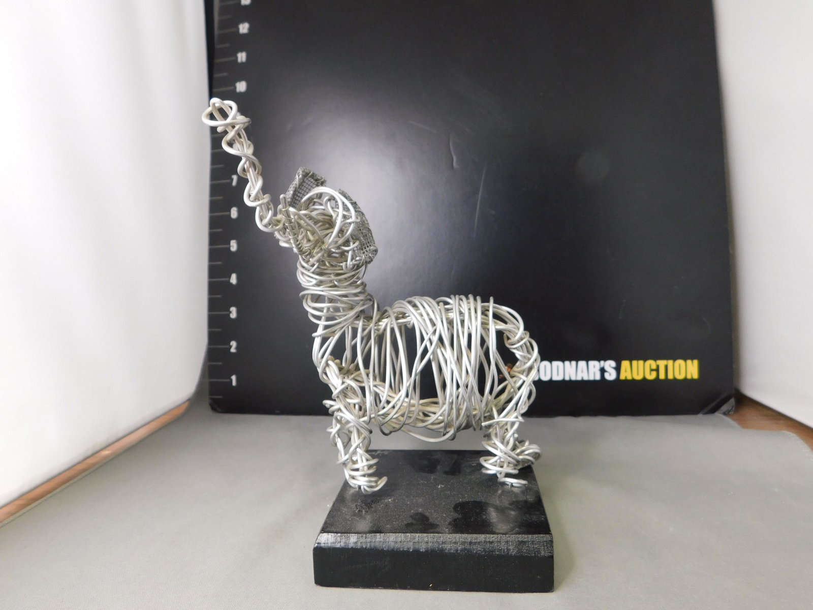 Wire Sculpture of Elephant: Wire Sculpture of Elephant. Handmade by Stephen Seifer. Measures 6.5" tall. This sale will be broadcast live on sale day with an auctioneer and caller calling full descriptions of each lot being sold,
