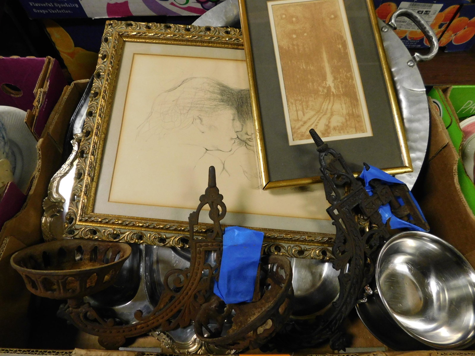 Box Lot with Metal, Toll ware and Framed Art: Misc. Box Lot with Metal, Toll ware Platter, and Framed Art. This sale will be broadcast live on sale day with an auctioneer and caller calling full descriptions of each lot being sold, as well as vid