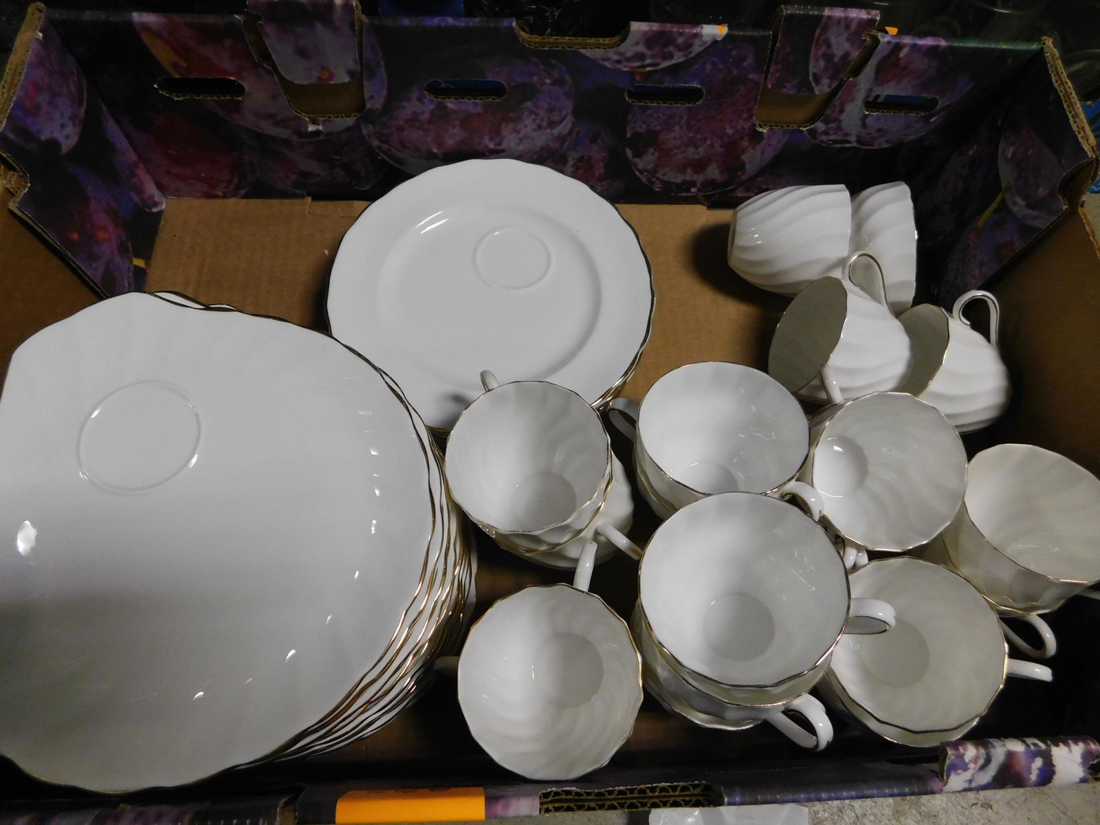 Box Lot of Tuscan English Teacups with Snack Plates: Box Lot of Tuscan English China Teacups with Snack Plates. This sale will be broadcast live on sale day with an auctioneer and caller calling full descriptions of each lot being sold, as well as video