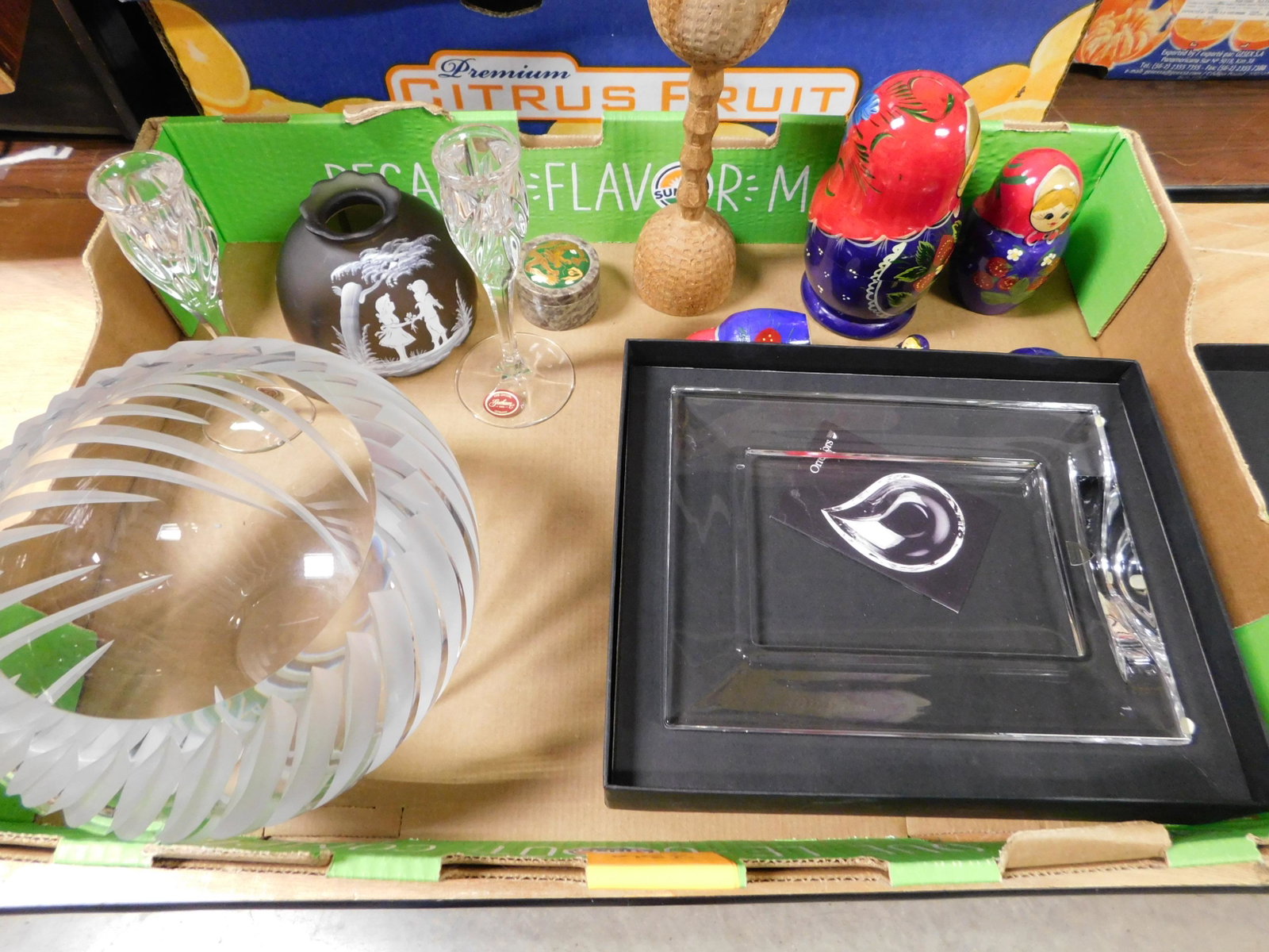 Box Lot of Orafers, Russian Nesting Eggs and Gorham: Box Lot with Orafers Picture Frame, Russian Nesting Eggs, and Gorham Candlesticks. This sale will be broadcast live on sale day with an auctioneer and caller calling full descriptions of each lot bein
