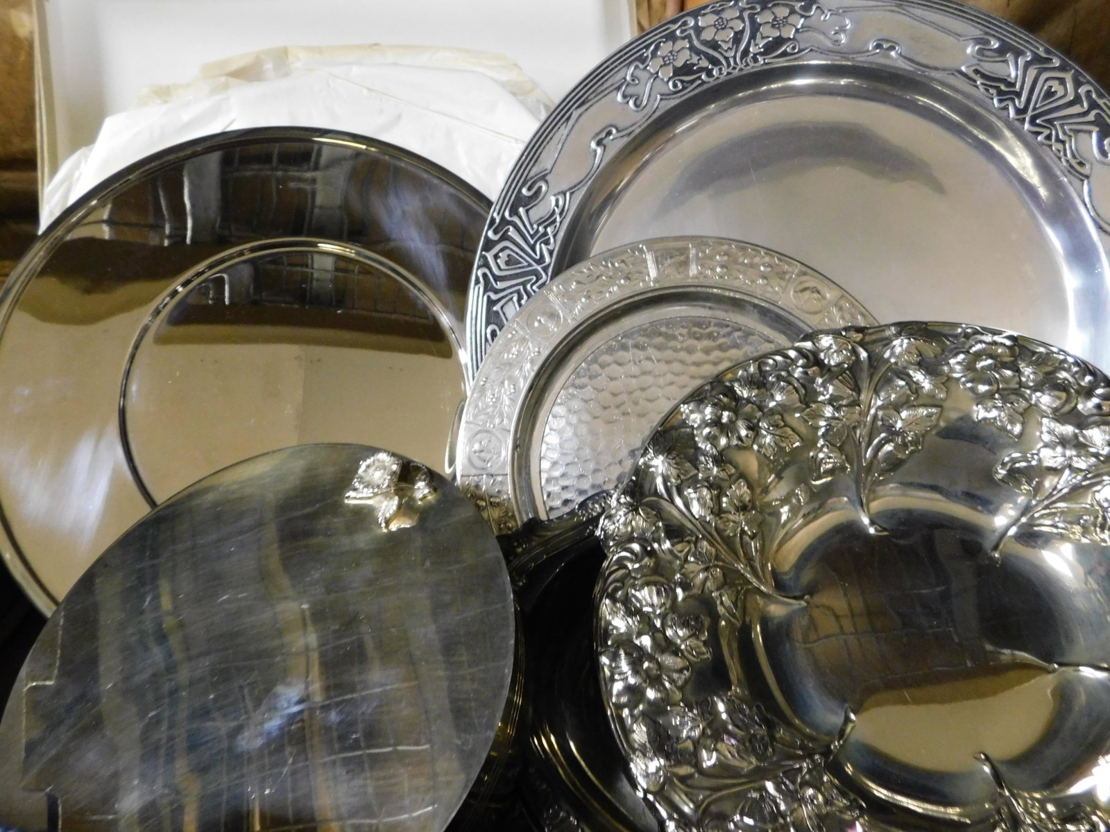 Box Lot of Silver-plate: Box Lot of Silver-plate including Bouillet Bourdelle Chargers. This sale will be broadcast live on sale day with an auctioneer and caller calling full descriptions of each lot being sold, as well as v