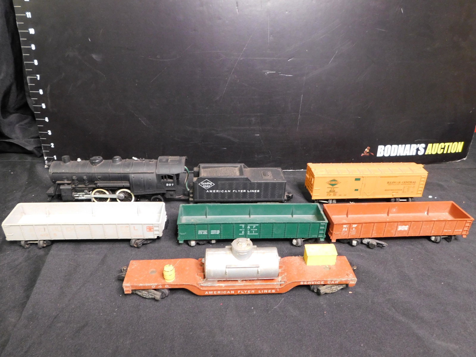 American Flyer Lot of Engine and Rolling Stock: American Flyer Lot of Engine and Rolling Stock Loose. Includes Reading Engine and Tender 307, Illinois Central Box Car 802, Bethlehem Steel Gondola 24125, Texas & Pacific Gondola 631, Frisco Lines Gon