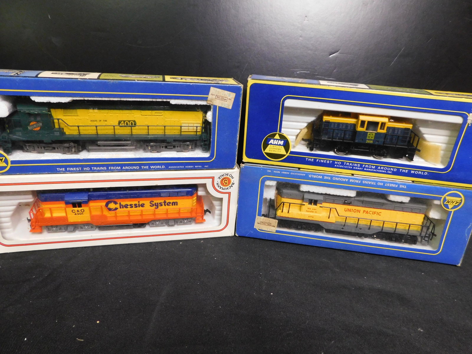 Lot of 4 HO Scale Engines: Lot of 4 HO Scale Engines includes AHM Northwestern Diesel, Bachmann Chelsie System Diesel, AHM Union Pacific Diesel, AHM Santa Fe 44 Tonner Diesel. You are bidding at a live sale, please read the ter