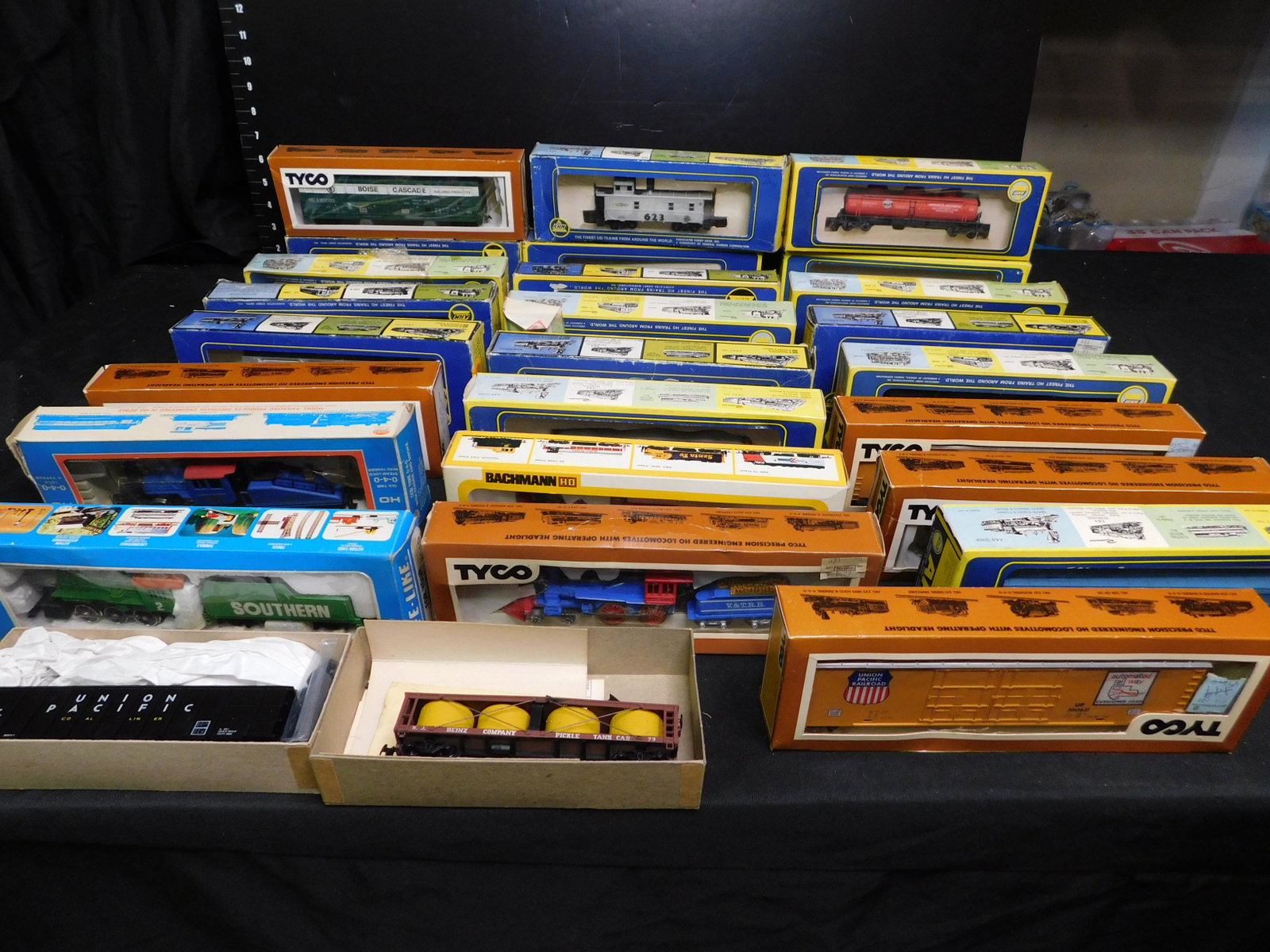 Large Group Lot of HO Scale Engines and Rolling Stock: Large Lot of HO Engines and Rolling Stock. Included are Model Power B&O General Steam Engine, Life-Like Southern 060 Steam Engine, Bachmann Jupiter 440 Steam Engine, Round House Hopper, Athern Vat Car