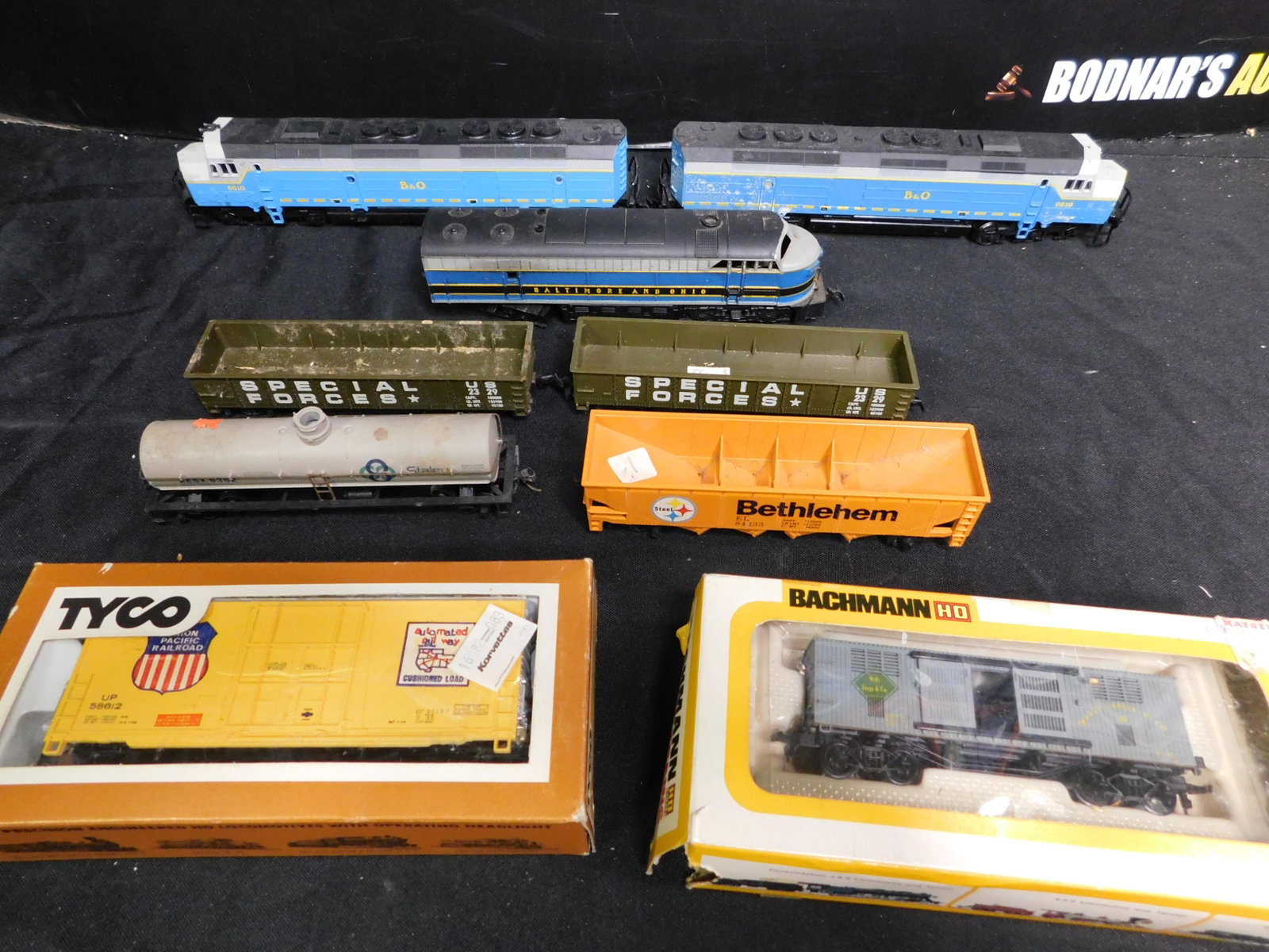Lot of HO Scale Engines and Rolling Stock: Lot of HO Scale Engines and Rolling Stock. Included is B&O Diesel Set - Both Powered, B&O FT Powered Diesel and 6 Pieces of Rolling Stock. You are bidding at a live sale, please read the terms and con