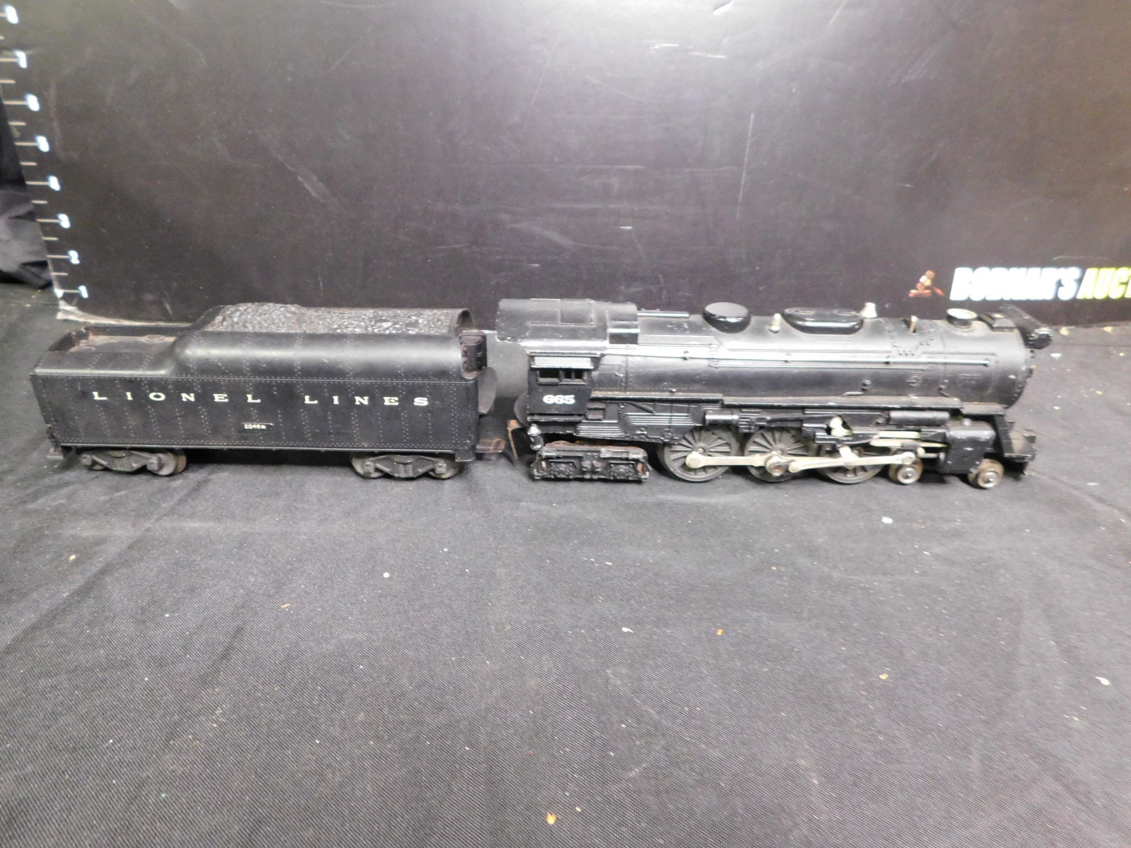 Lionel 665 Steam Engine with 2046W Whistling Tender: Lionel 665 Steam Engine with 2046W Whistling Tender. You are bidding at a live sale, please read the terms and conditions. We are offering contact-less pick ups at our South Brunswick location by APPO
