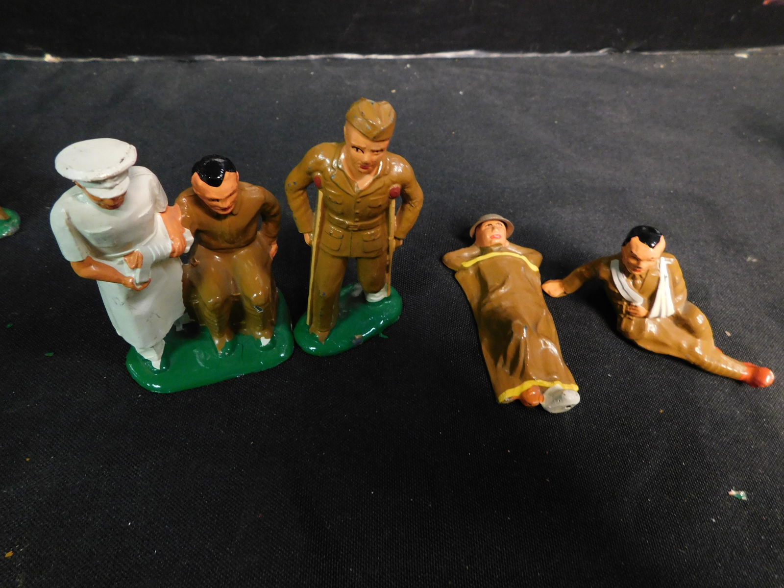 Lot of 4 metal Wounded Soldiers: Lot of 4 metal Wounded Soldiers. World War 1 in near mint condition You are bidding at a live sale, please read the terms and conditions. We are offering contact-less pick ups at our South Brunswick l